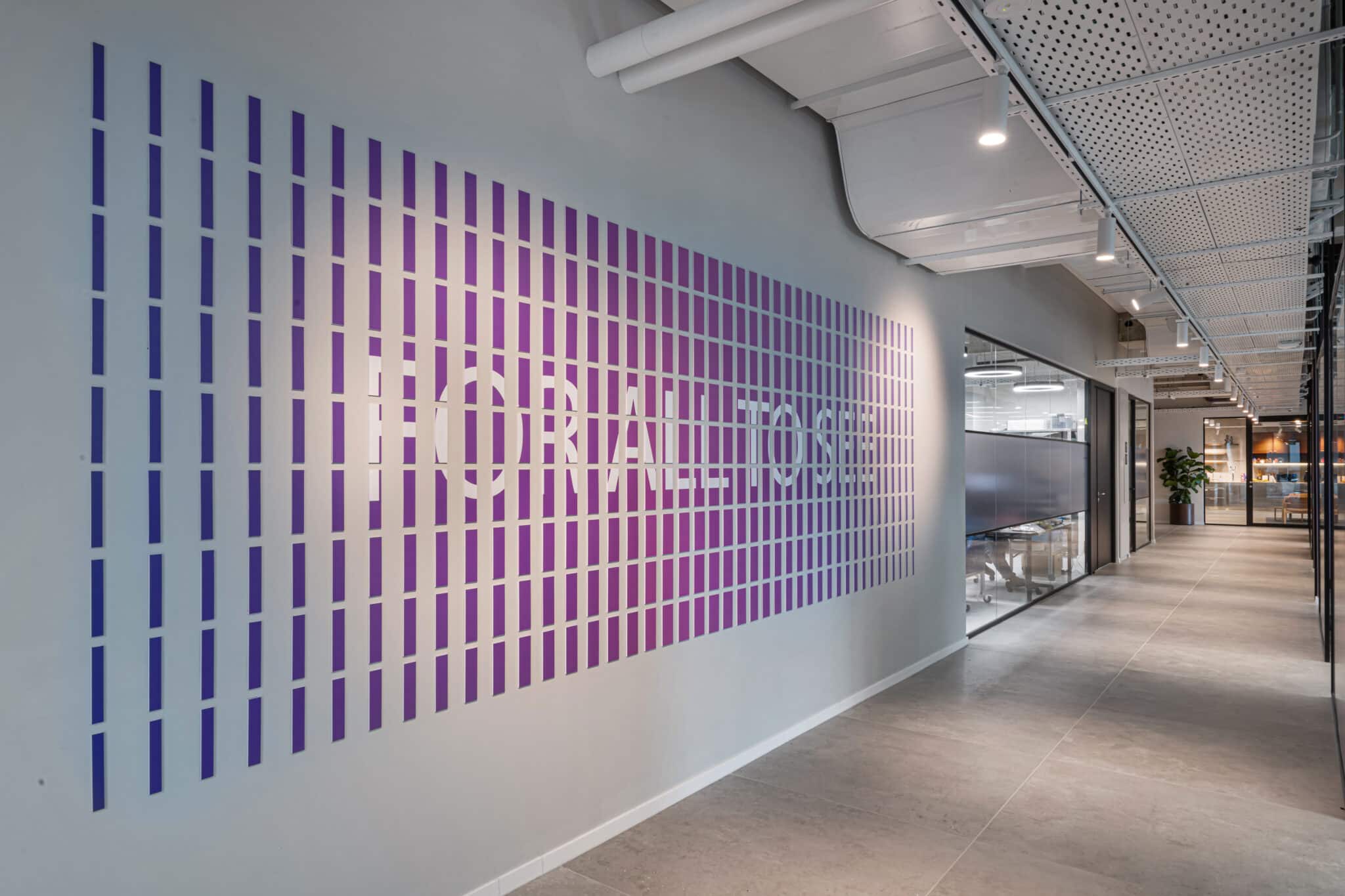 Purple gradient slat wall spelling a brand slogan
