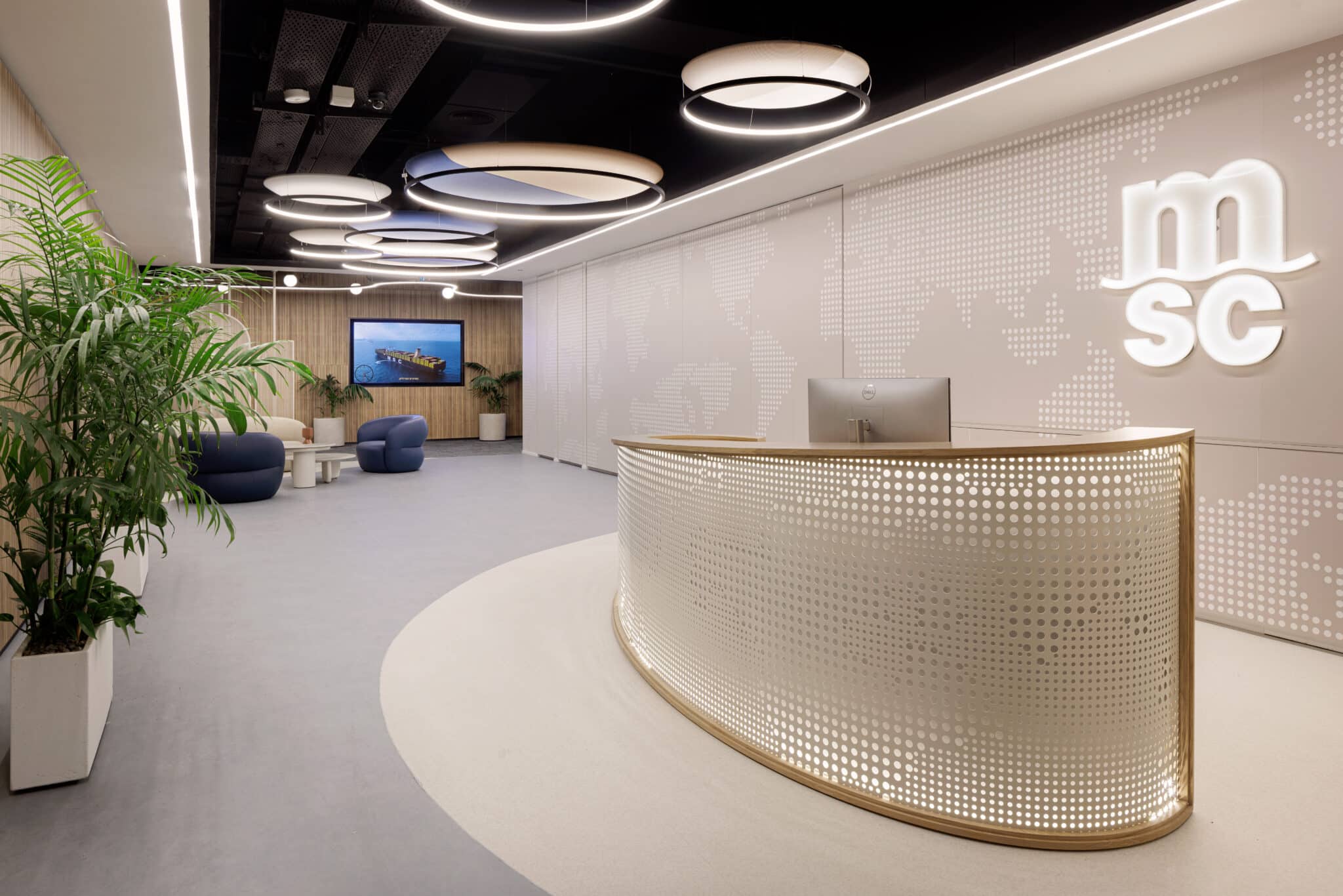 msc 3D logo on a dotted world map wall above the reception desk