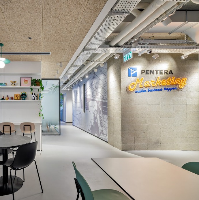 PENTERA Marketing 3D logo and neon script on a concrete block wall