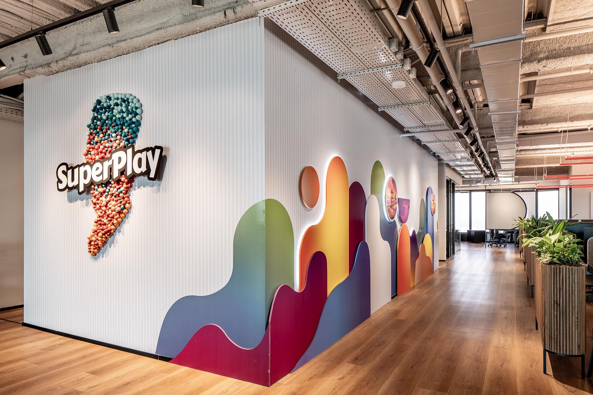 Ball covered lightning bolt logo on a fluted corridor wall
