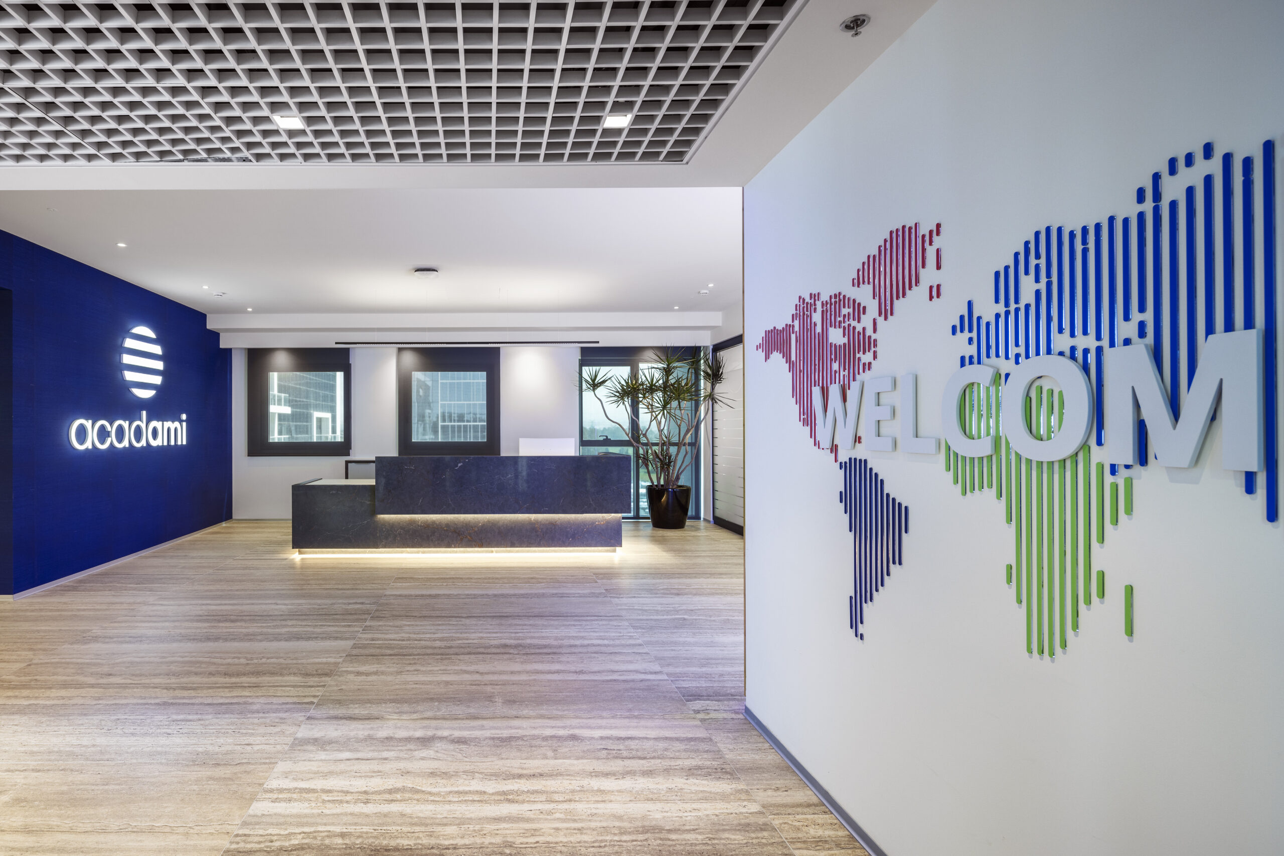 acadami reception with a 3D WELCOME world map wall