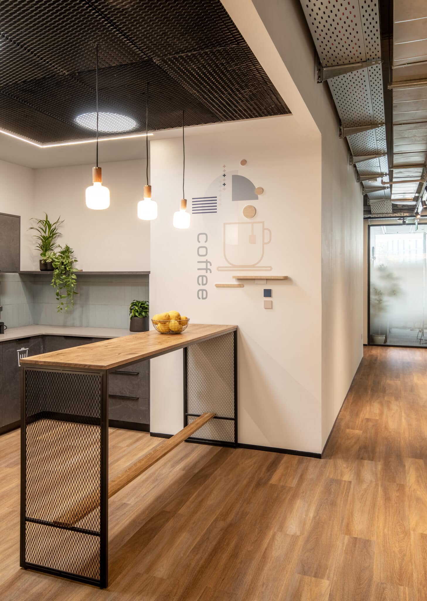 Coffee point wall graphic with a cup drawing next to the kitchen counter