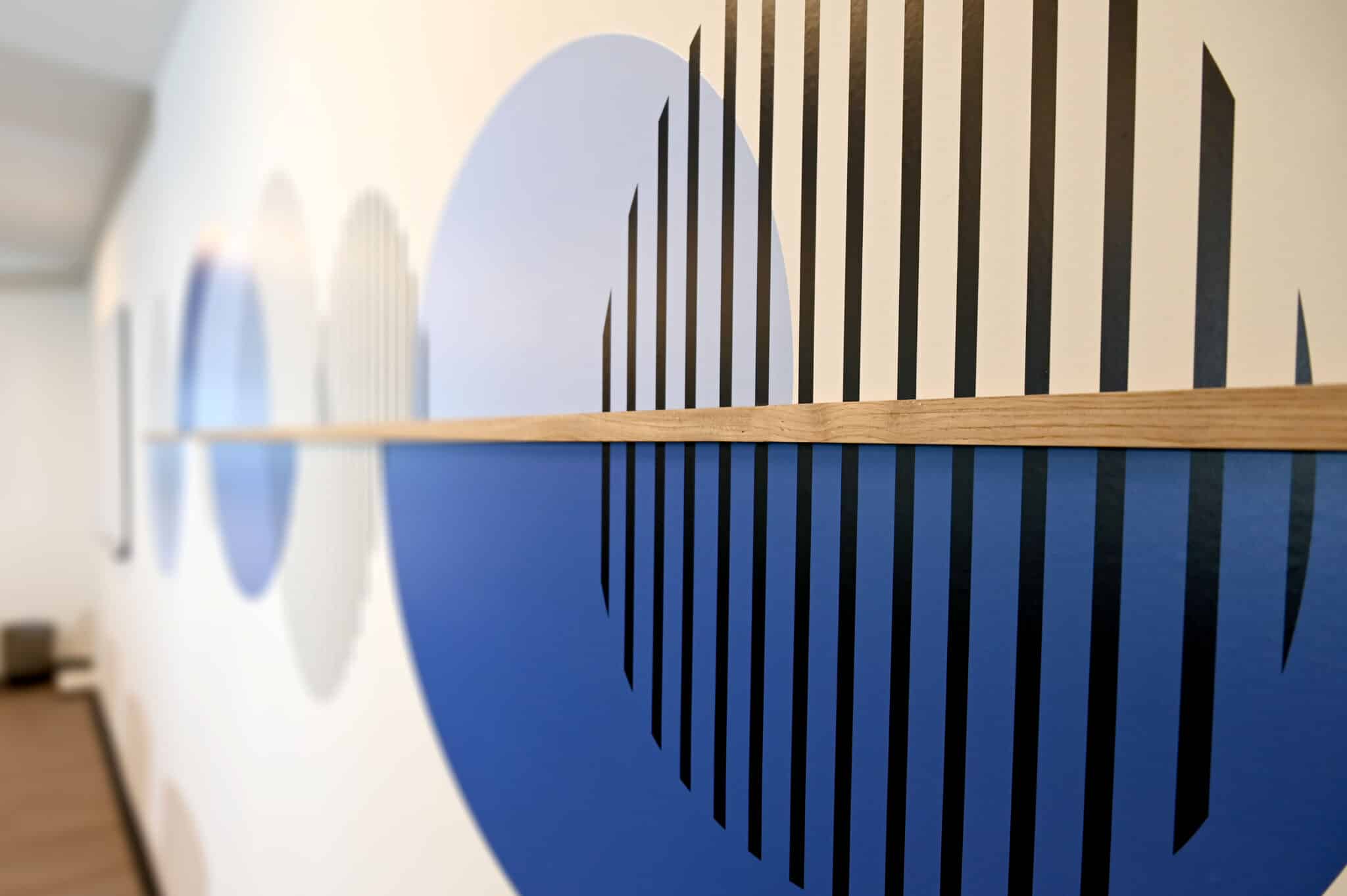 Close-up of a blue circles and stripes wall graphic