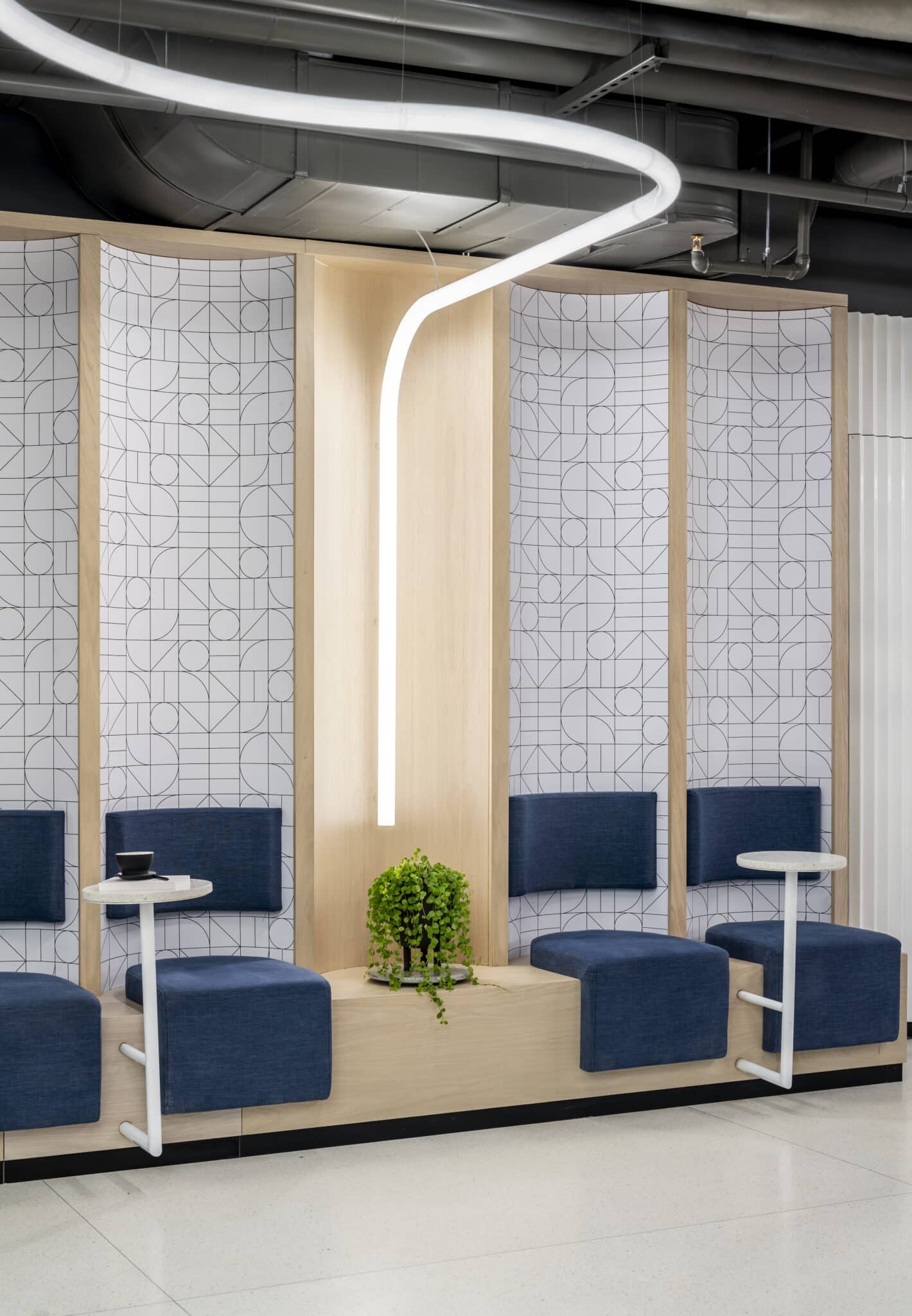 Printed line pattern panels behind seating alcoves