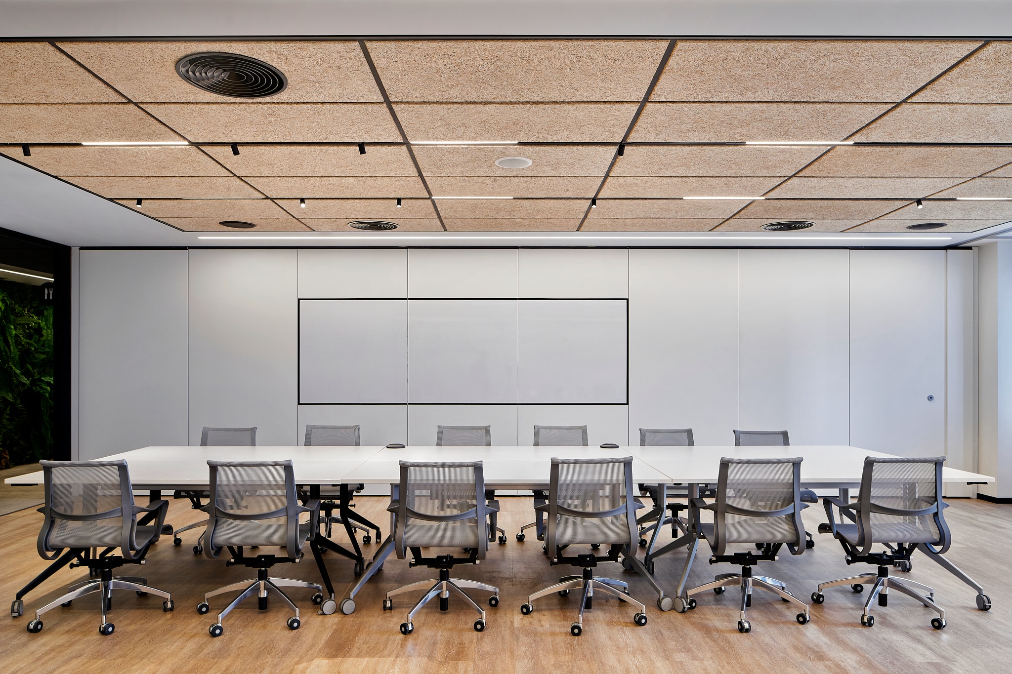 Whiteboard with a black frame on a meeting room wall