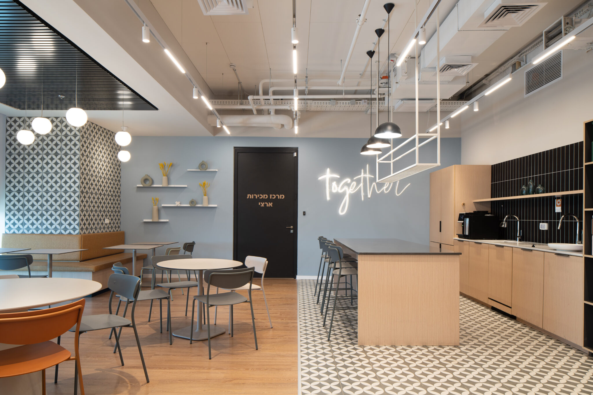 together neon script sign in an office kitchen with room signage