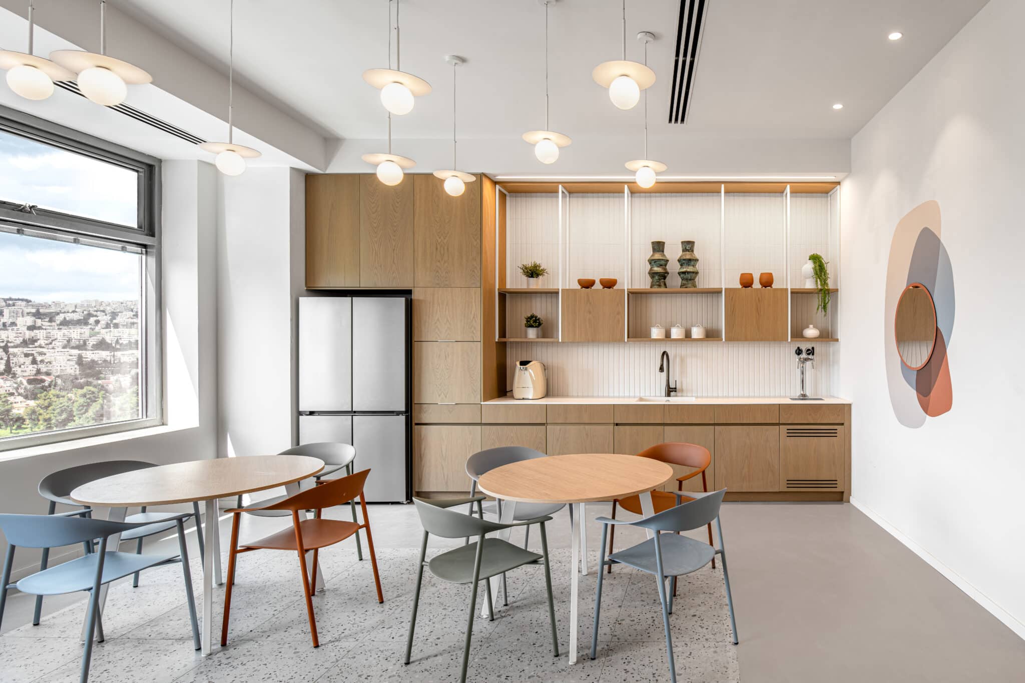 Rounded shapes wall artwork in an office kitchen