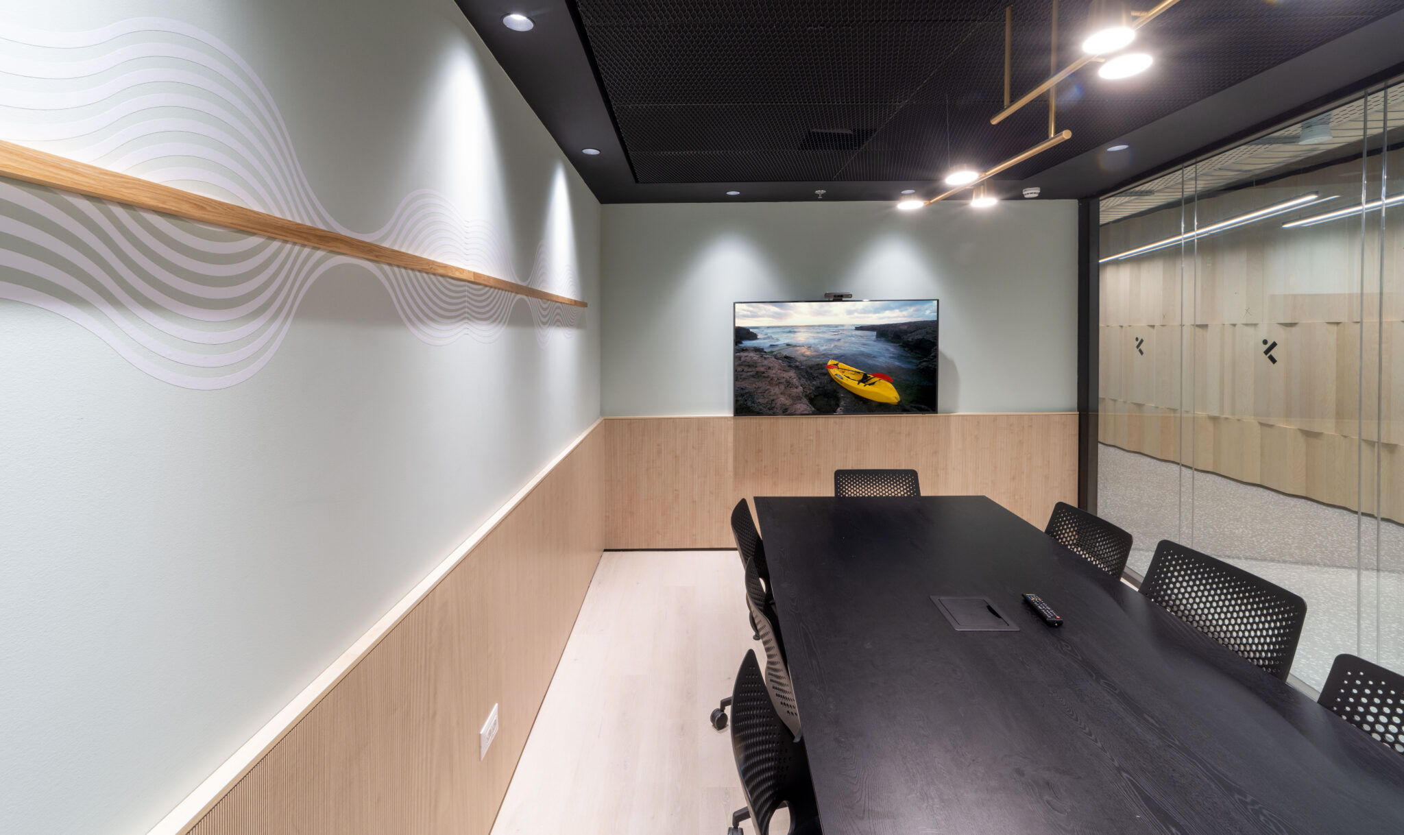 White wave line wall graphic in a meeting room