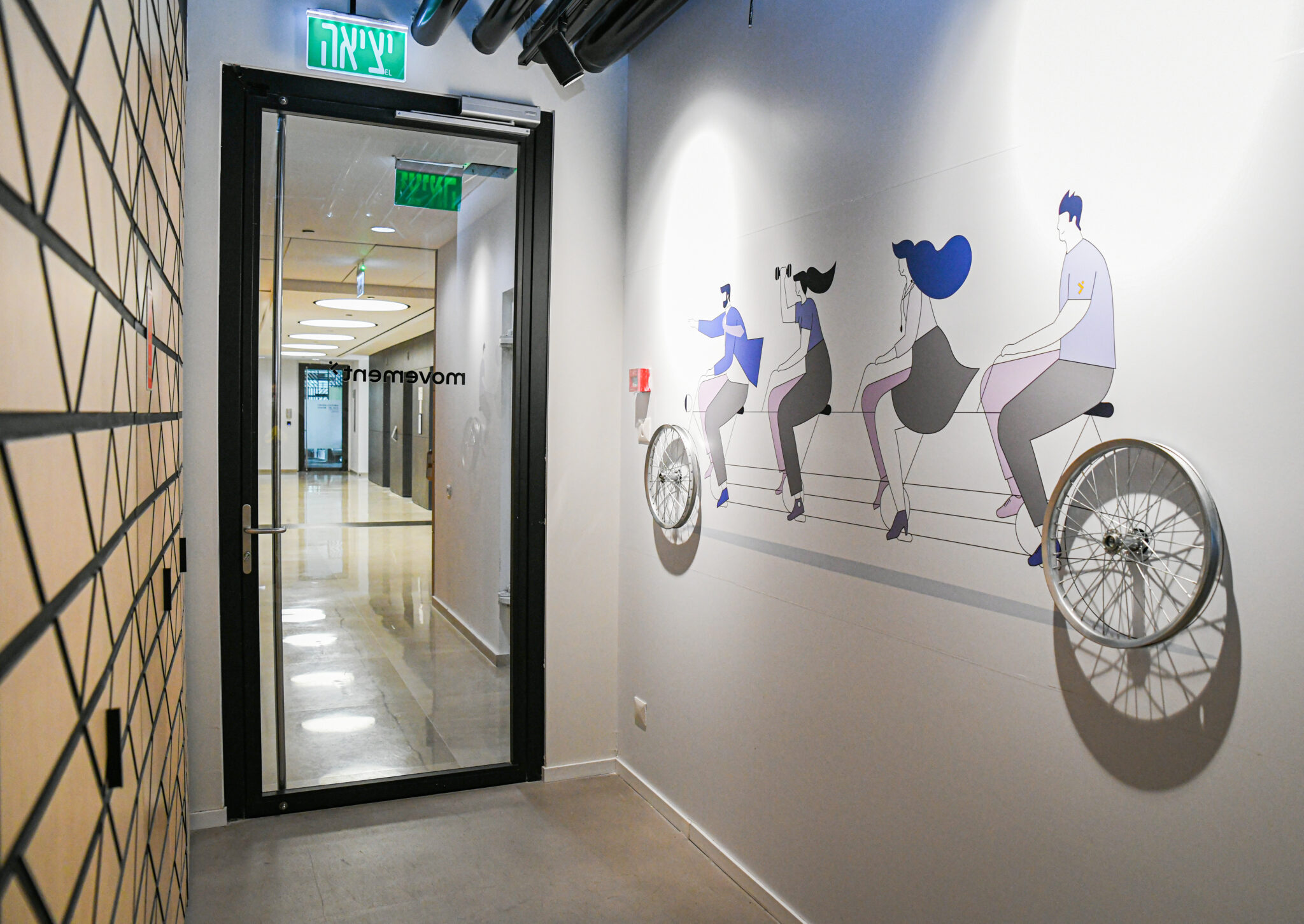Tandem bike wall graphic with real wheels as 3D elements