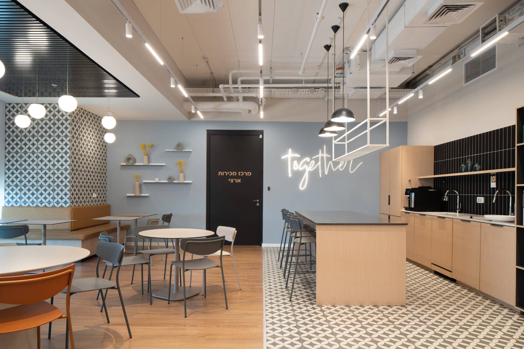 Neon together sign above a kitchen counter beside a patterned wall