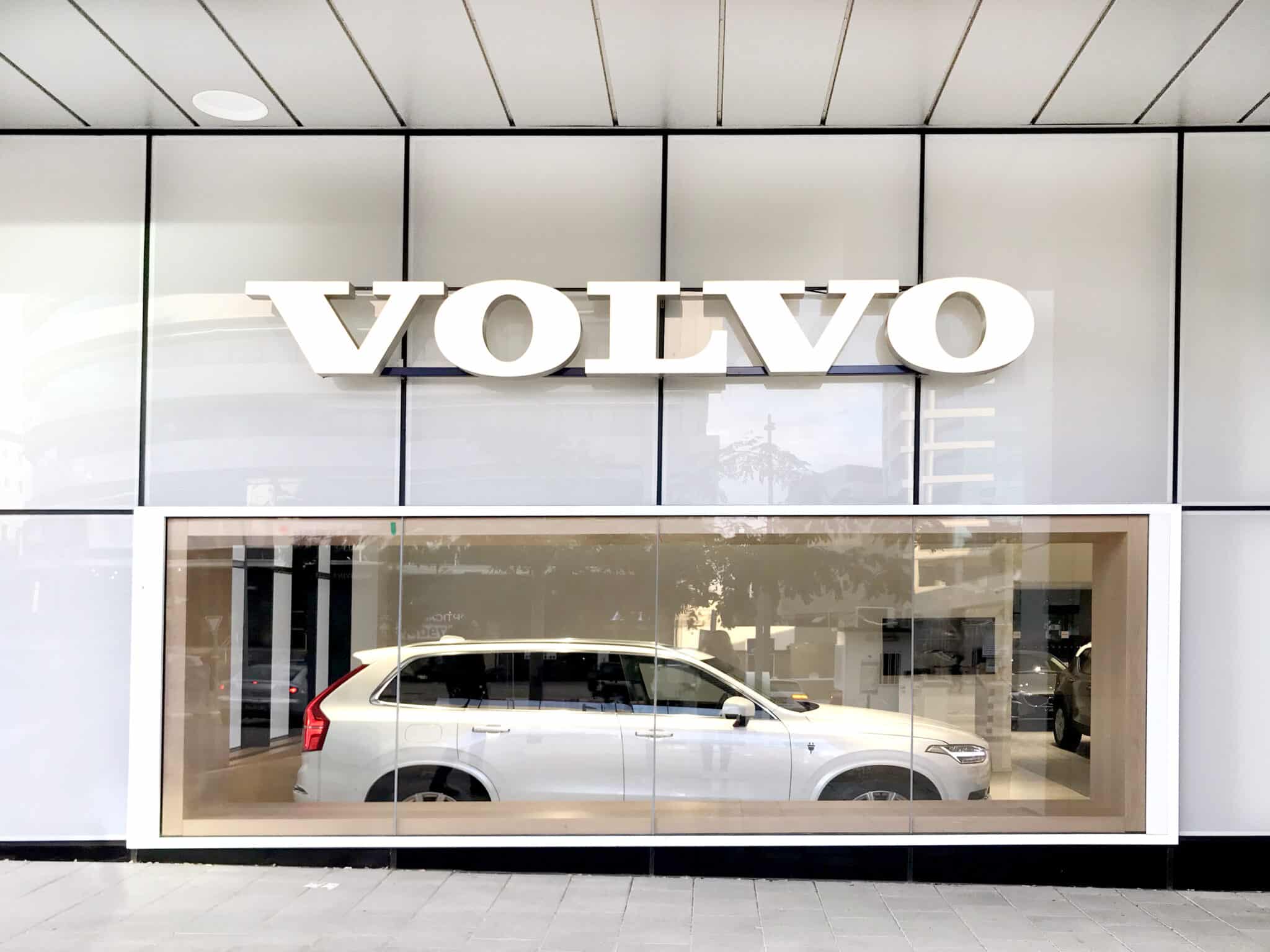 Dimensional VOLVO letters on the showroom facade above the display window