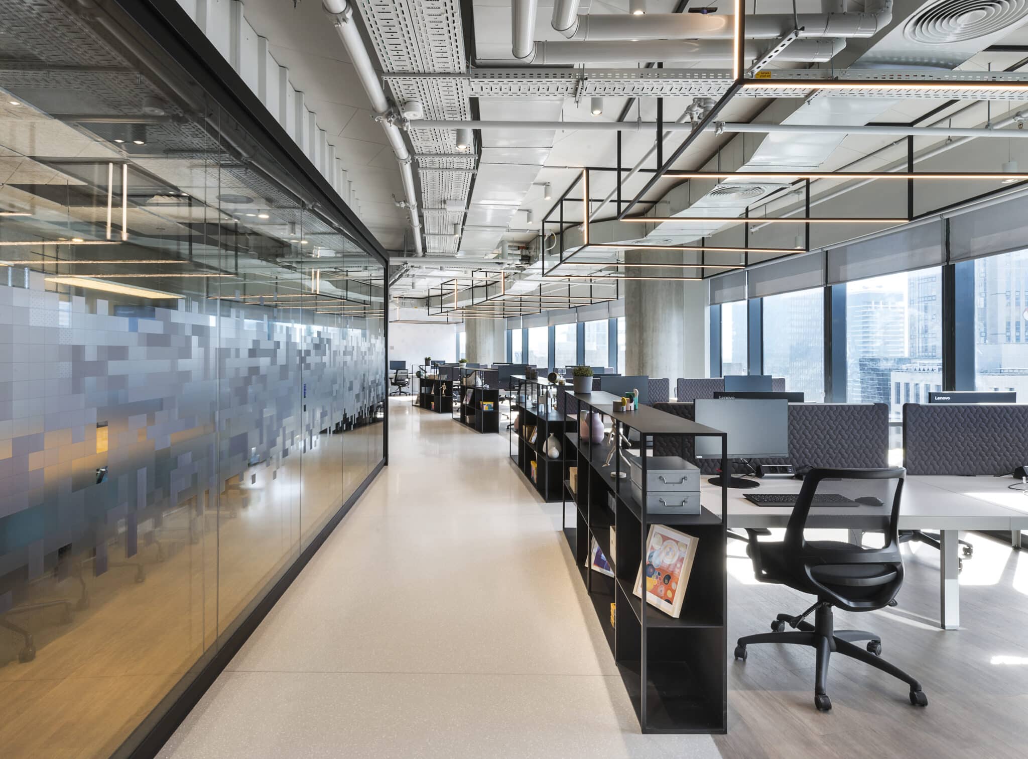 Frosted glass coating in scattered pixels along an office corridor
