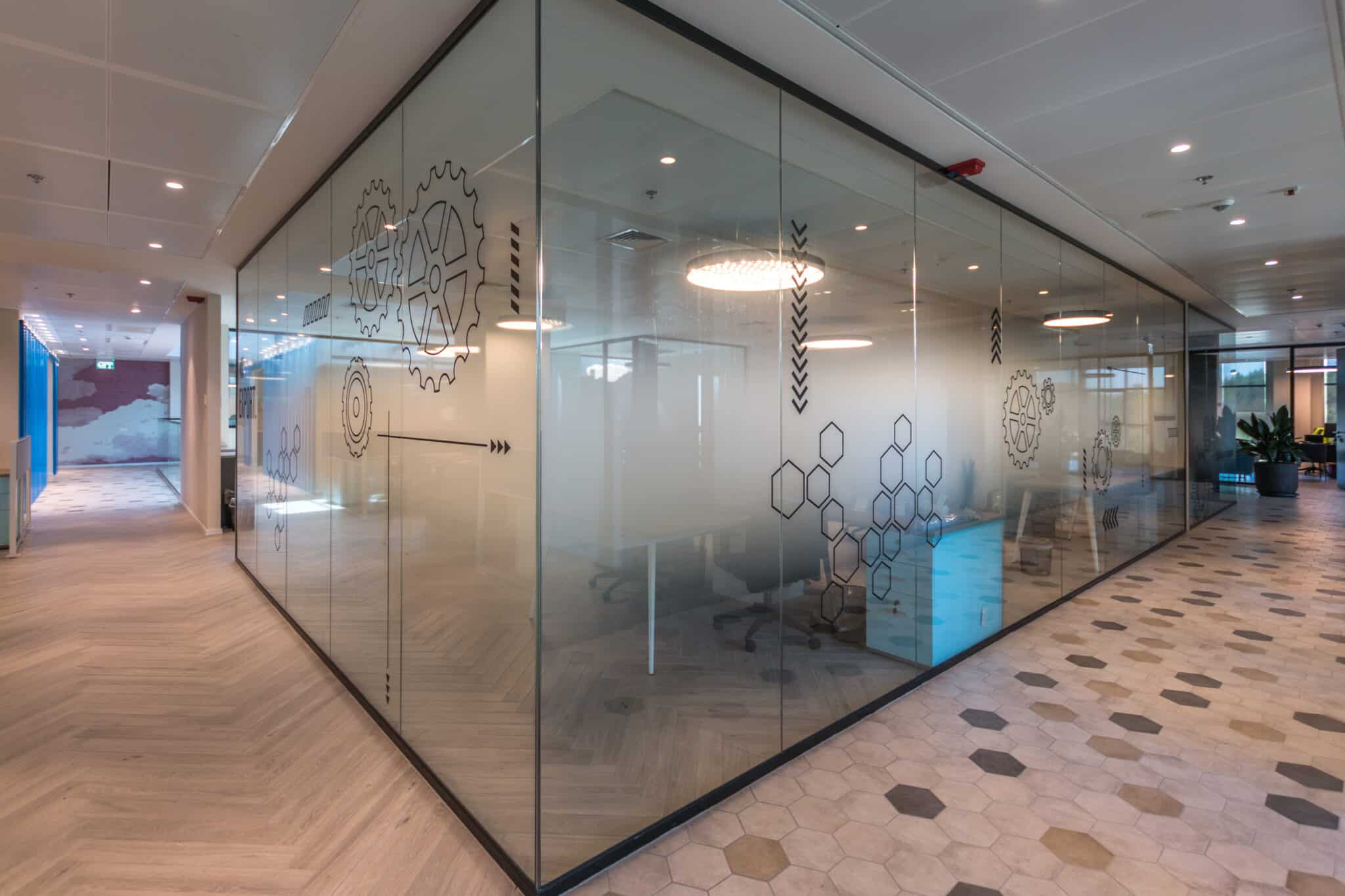 Ring pattern printed on glass partitions along a corridor