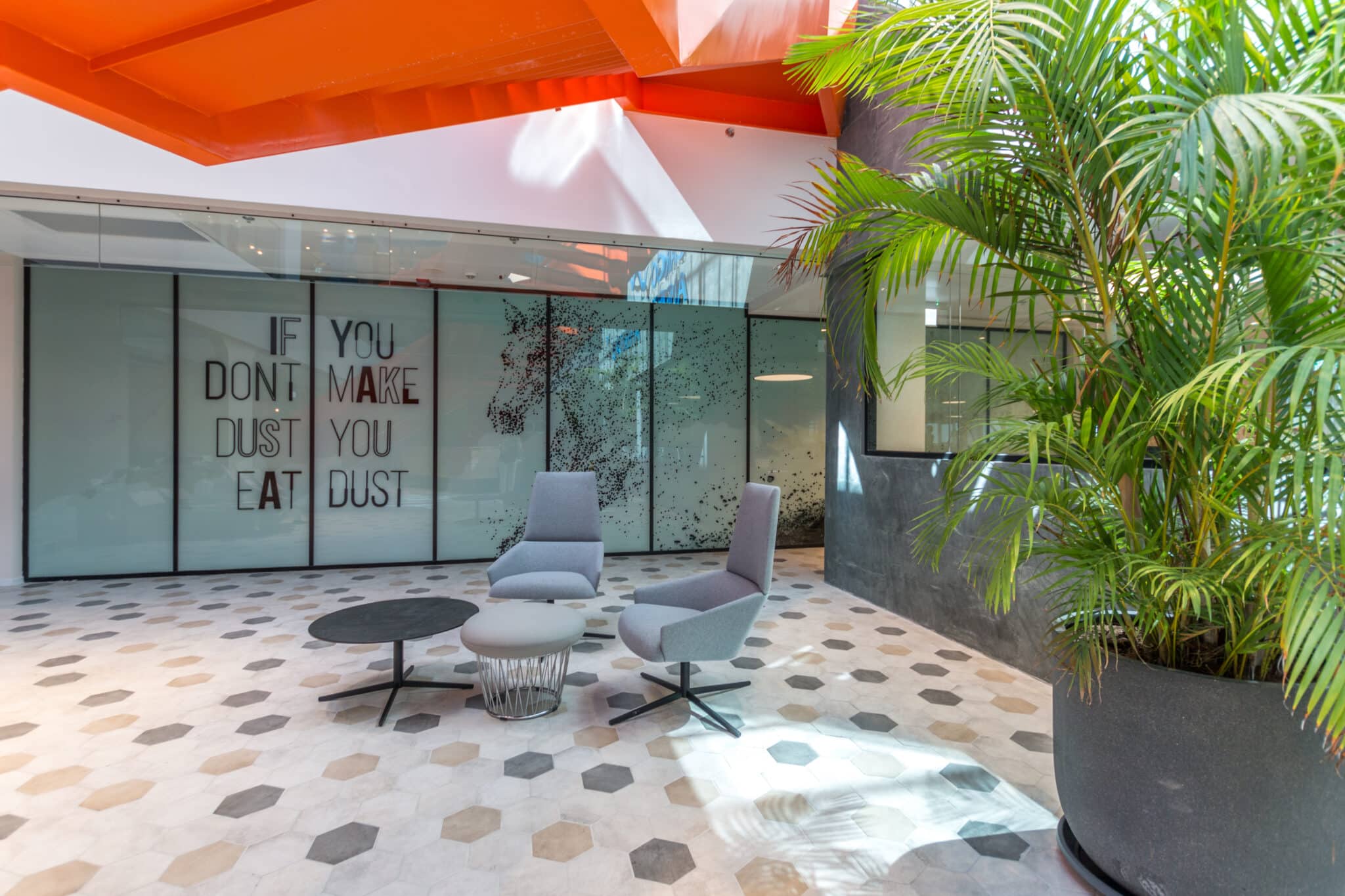 Gear and hexagon graphics printed on a glass meeting room