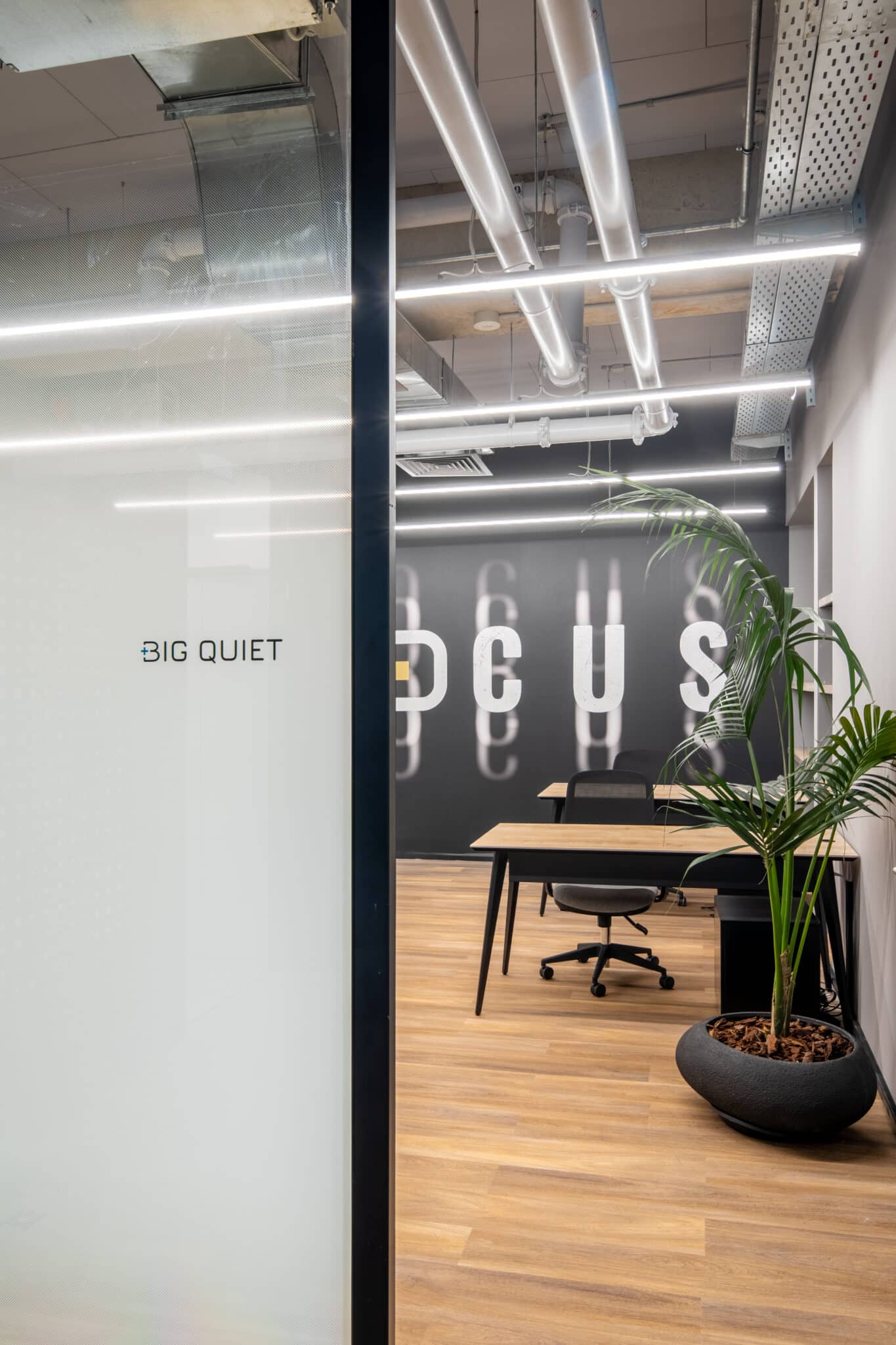 BIG QUIET room name on frosted glass with a FOCUS wall graphic