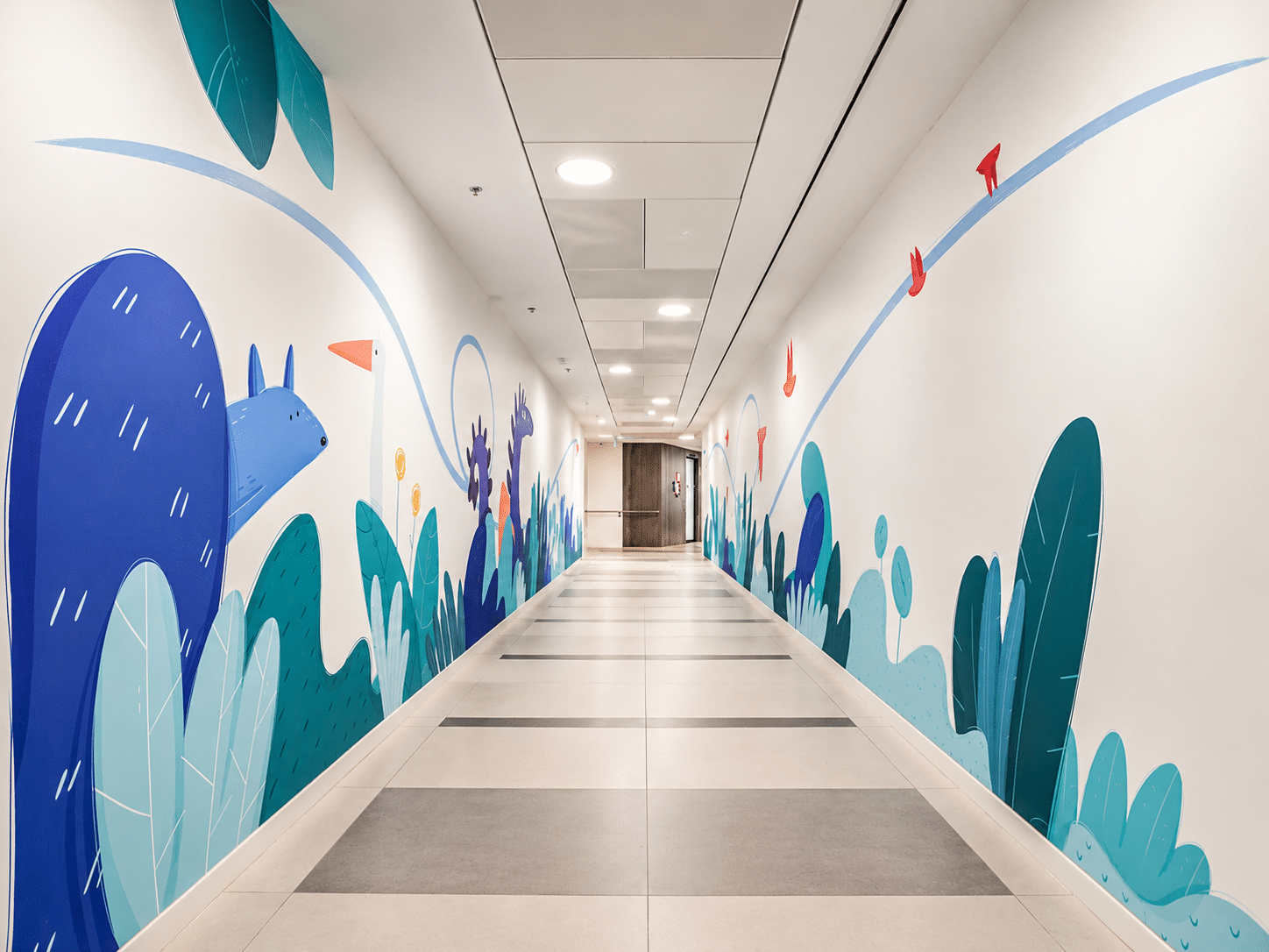 Illustrated corridor mural with leaves and a blue animal