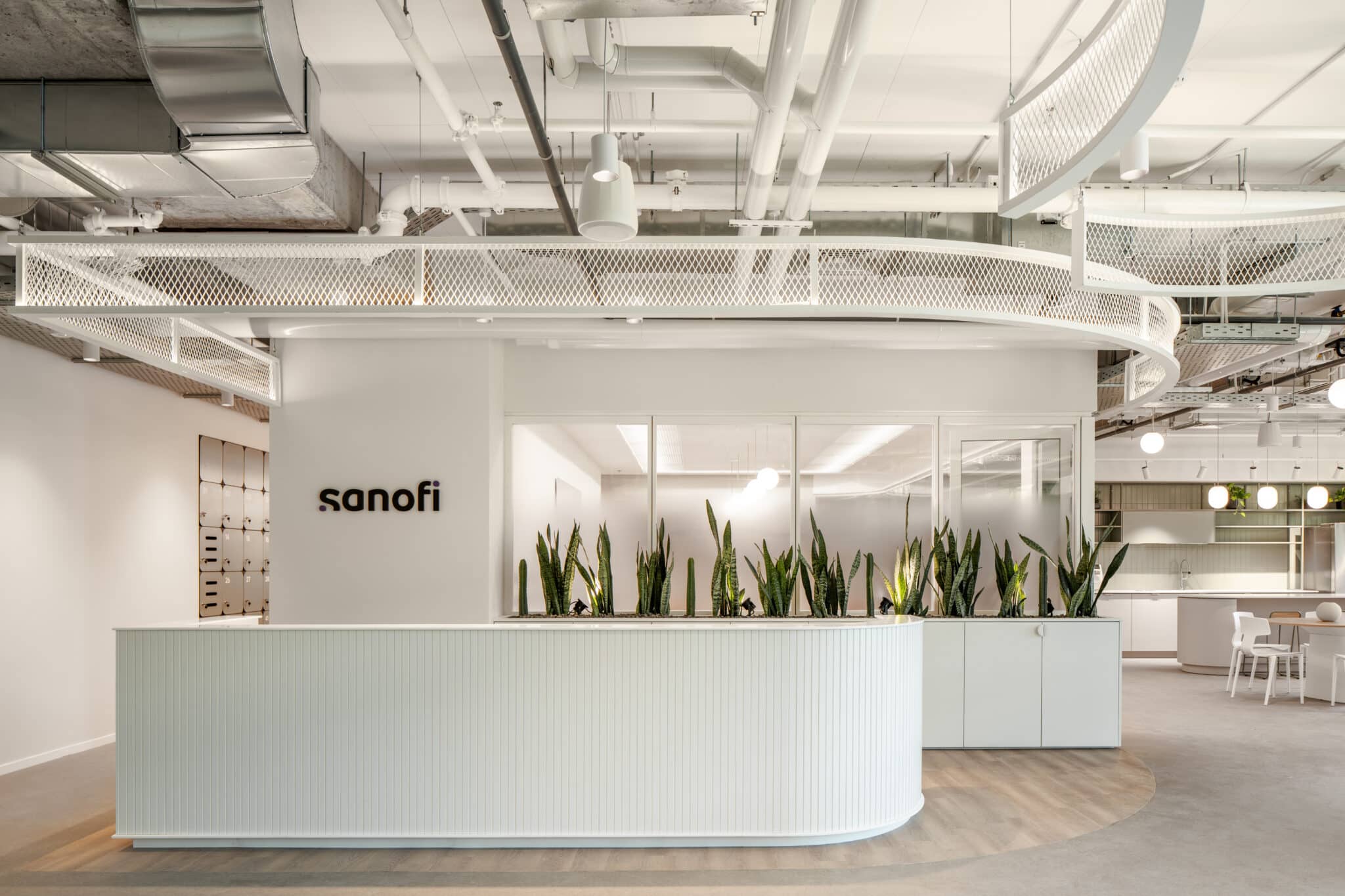 sanofi 3D logo on a curved reception wall