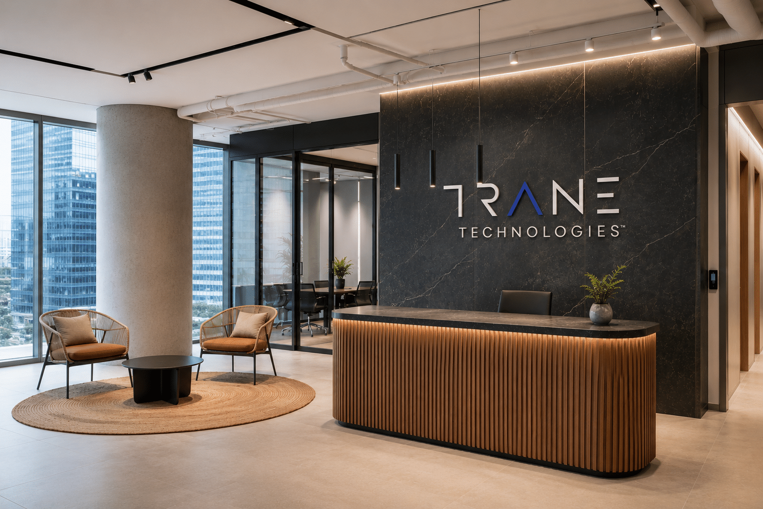 TRANE TECHNOLOGIES logo on a dark marble reception wall