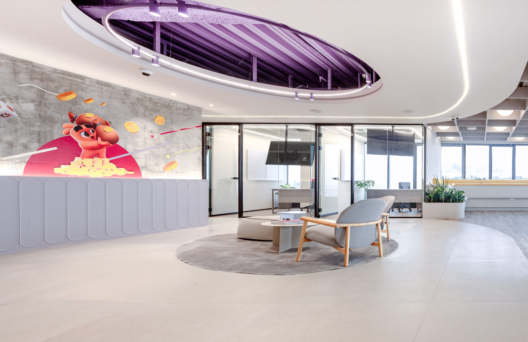 Character wall graphic on concrete beside frosted glass meeting rooms