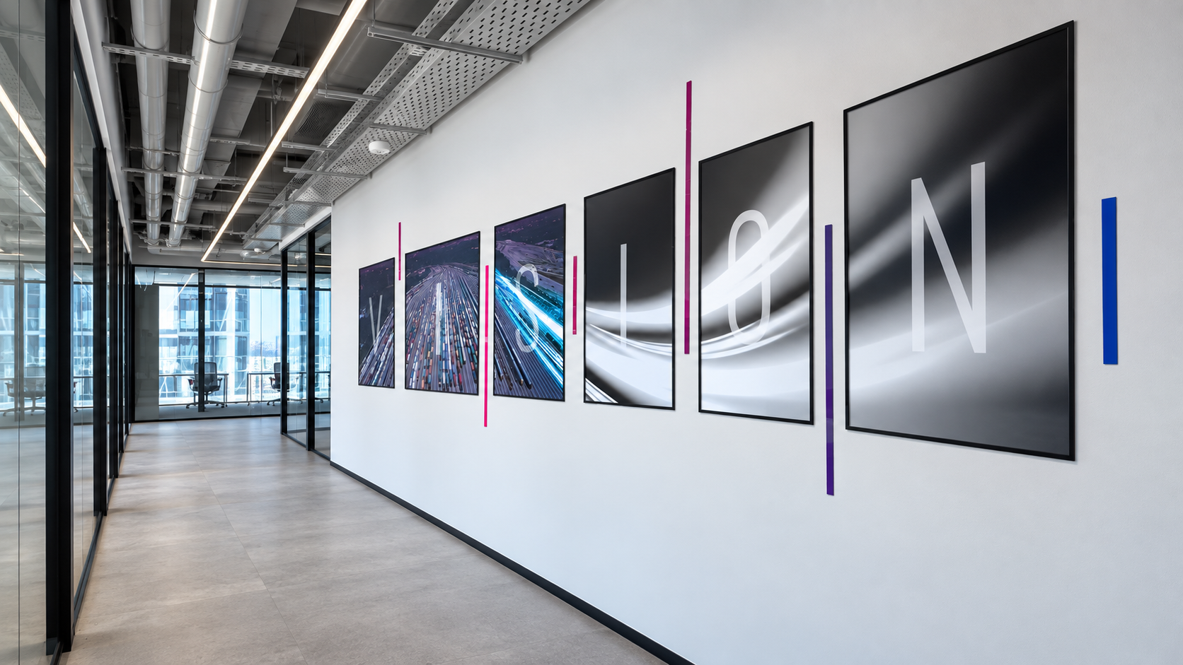 VISION framed print series on a corridor wall