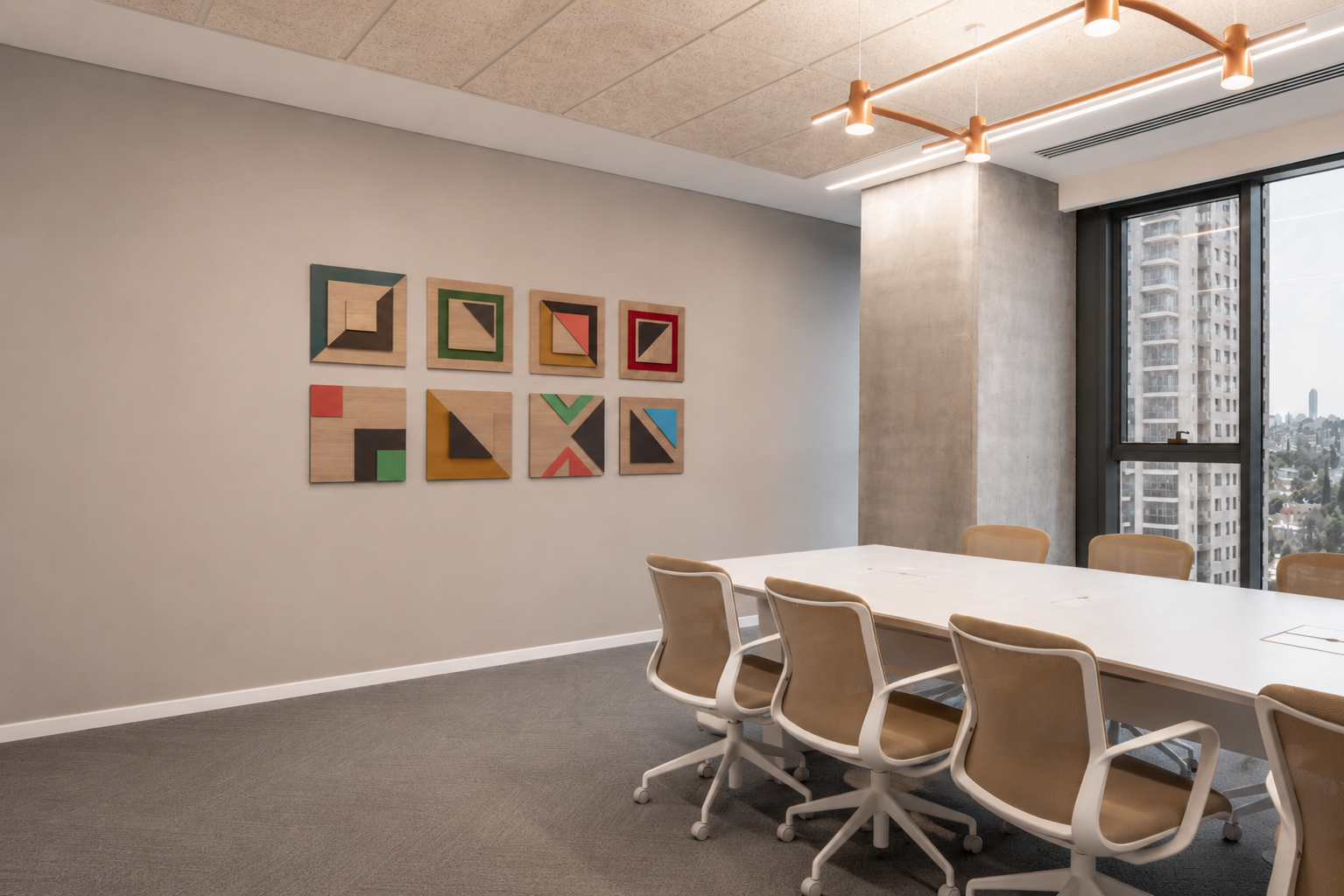 Boardroom with framed geometric wood artworks on the wall