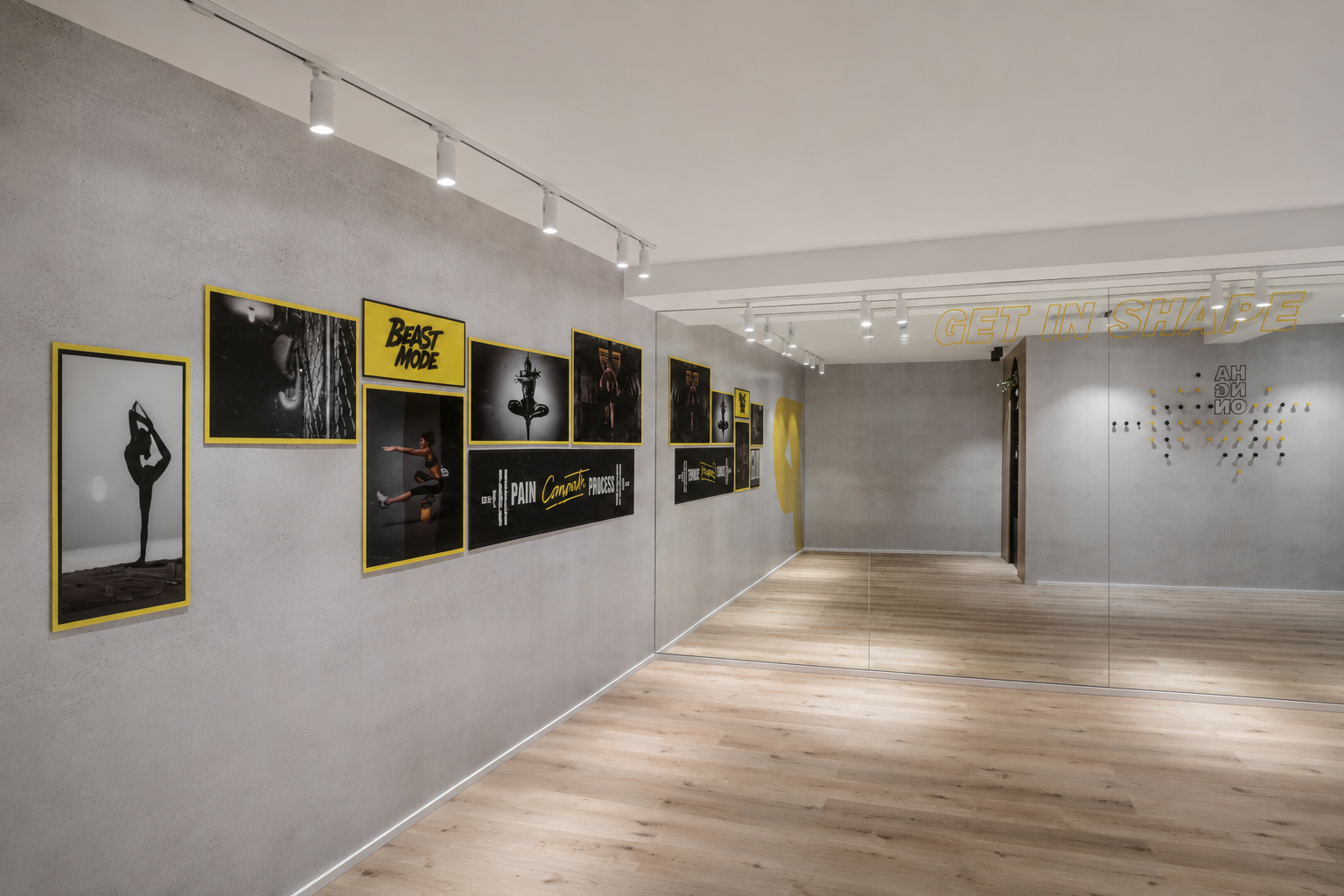 Studio wall with framed black and yellow fitness posters