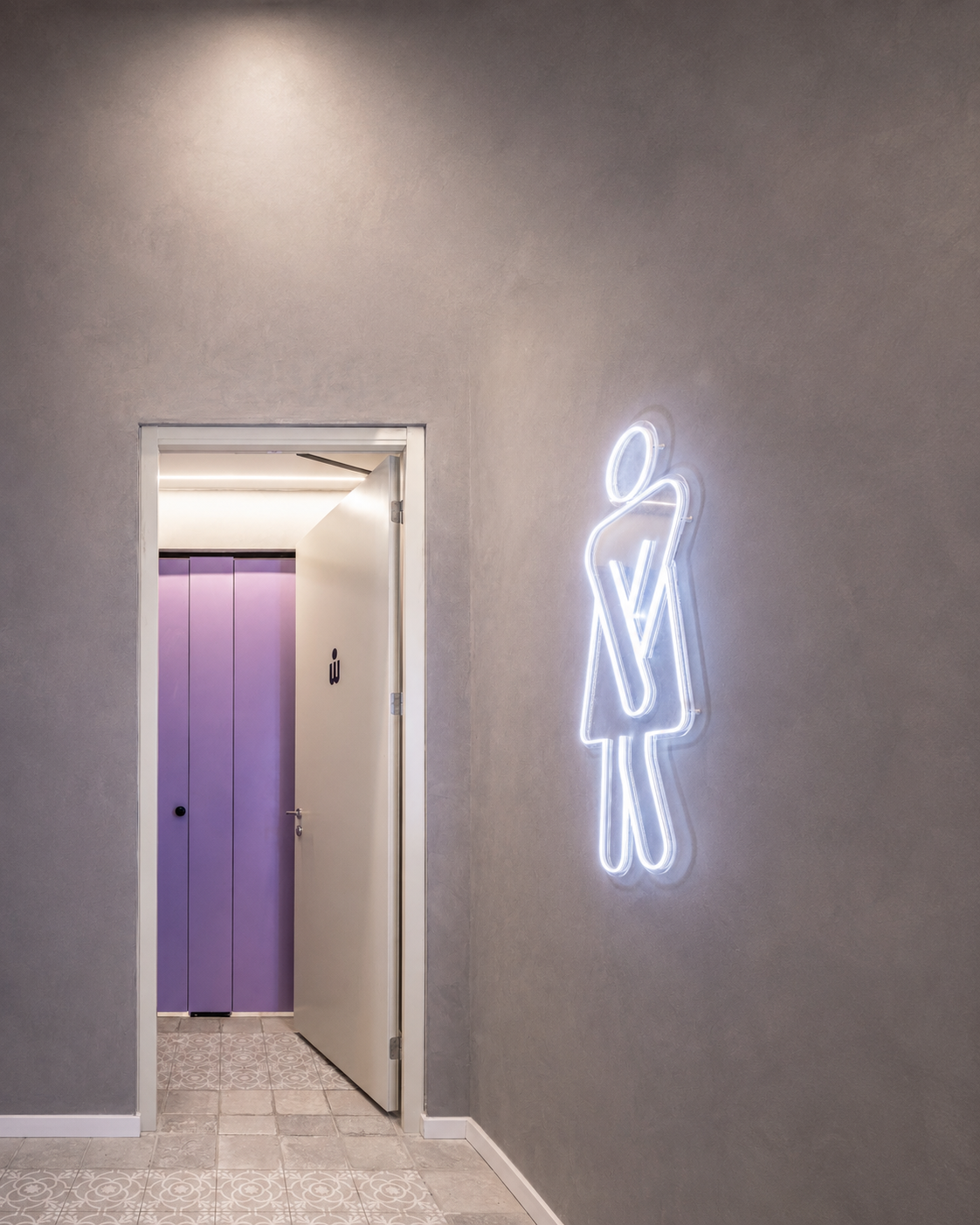 Women restroom neon sign next to a purple door