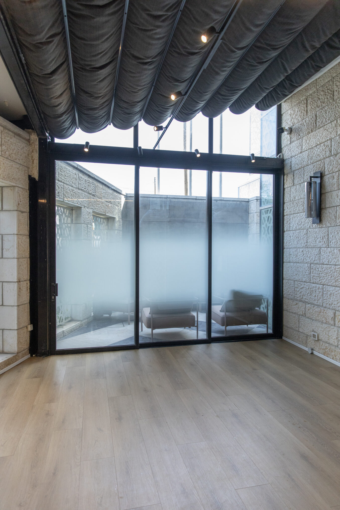 Glass door with frosted gradient film onto a terrace