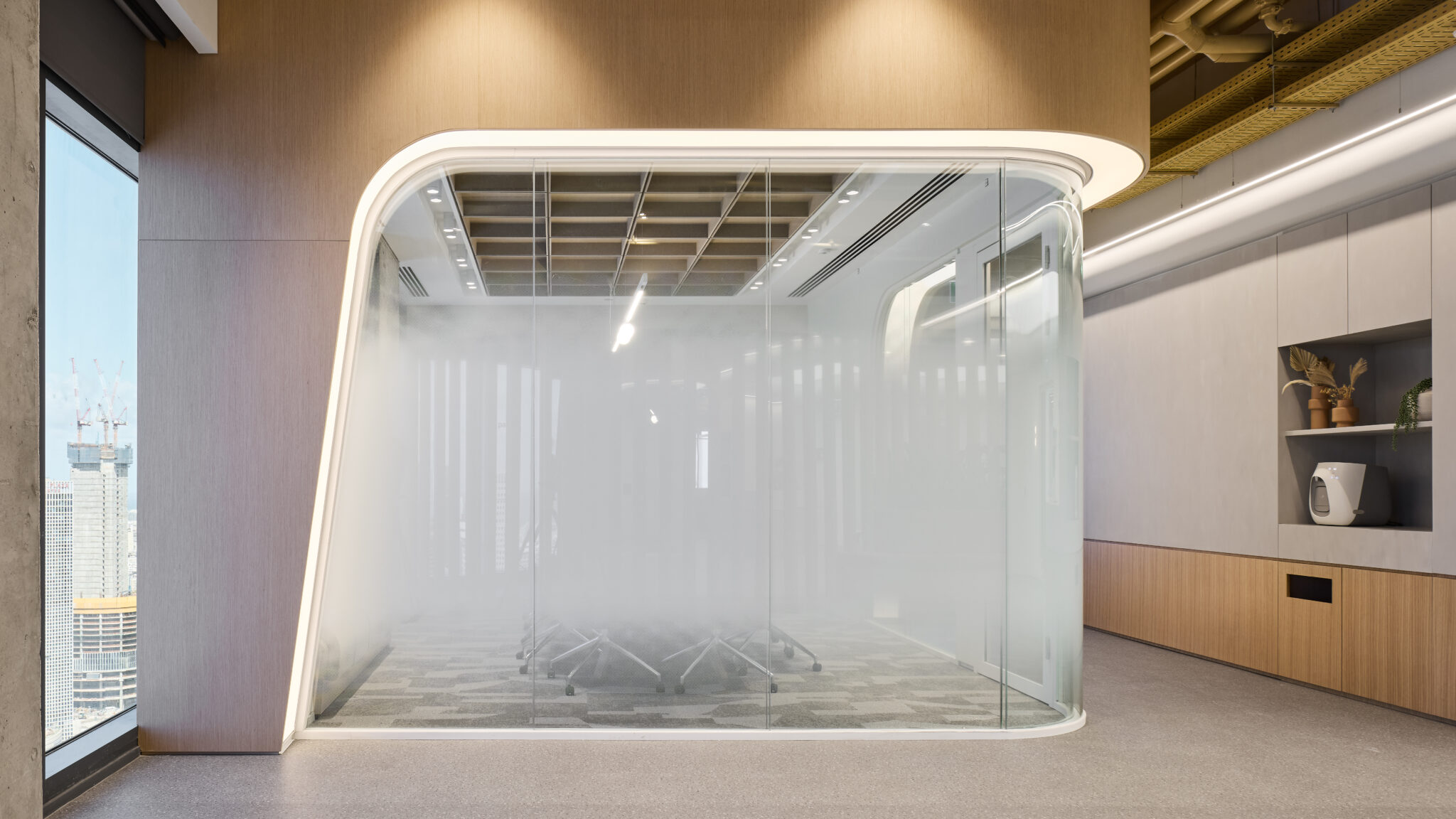 Rounded glass meeting room with frosted gradient film