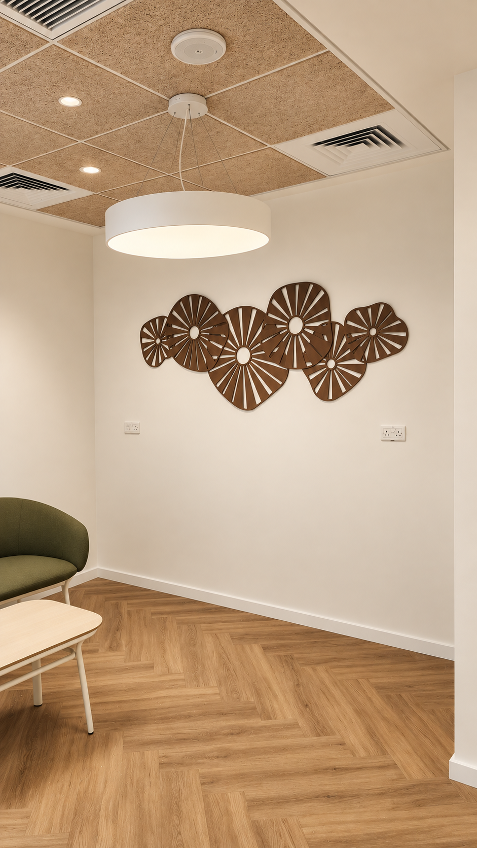 Brown laser-cut flower shapes on a waiting room wall