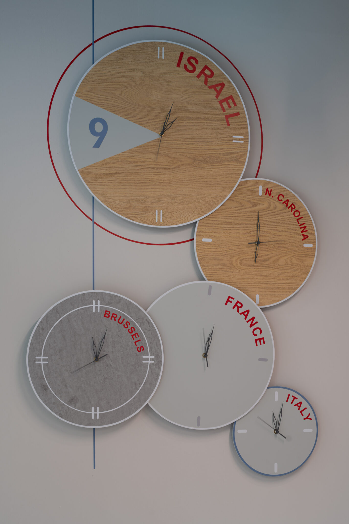World time clocks on wood and grey discs with city names