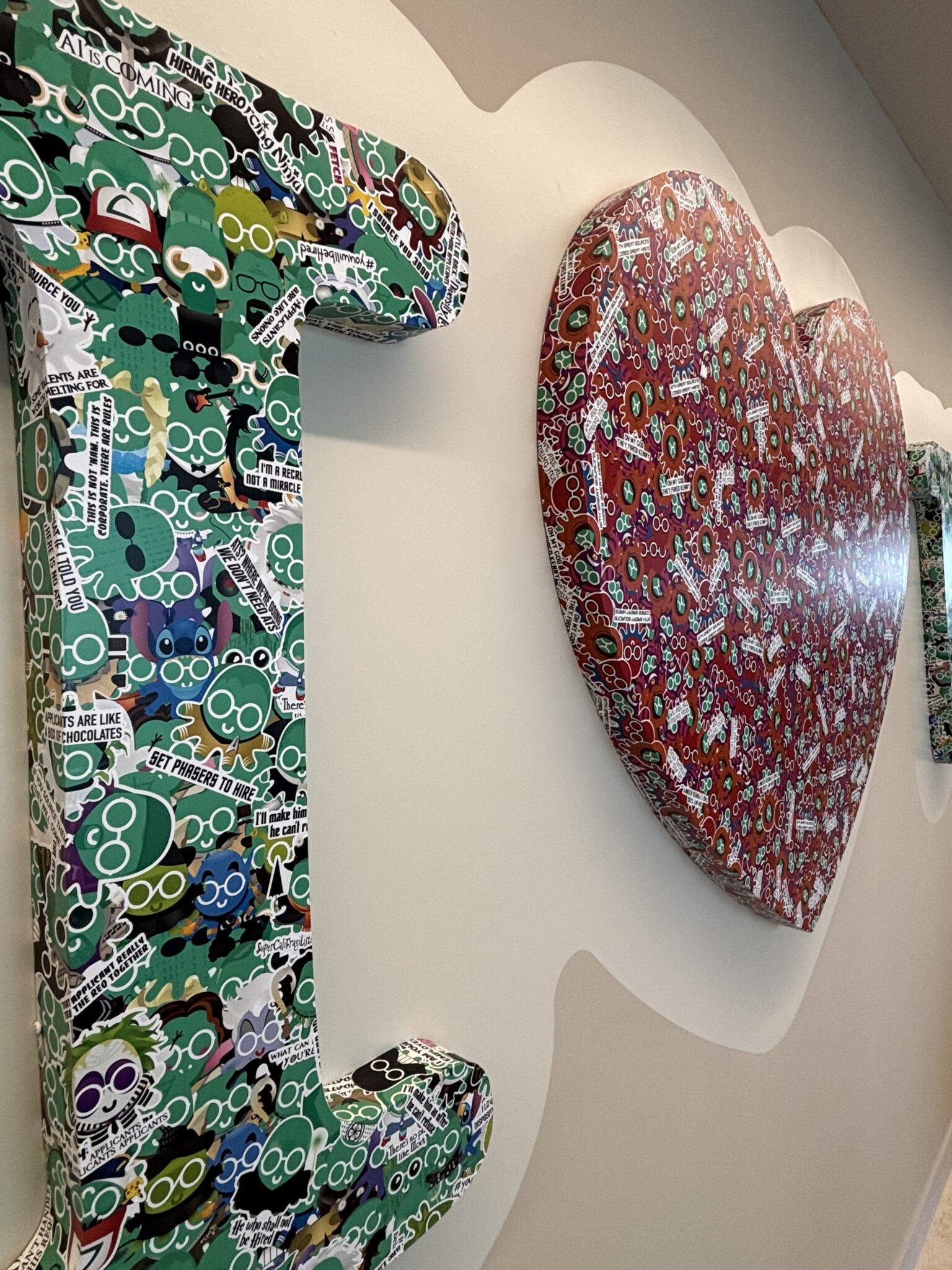 Large 3D letter and heart covered in colourful sticker art