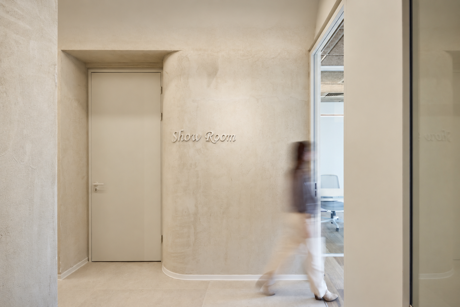 Show Room lettering on a concrete wall by a doorway