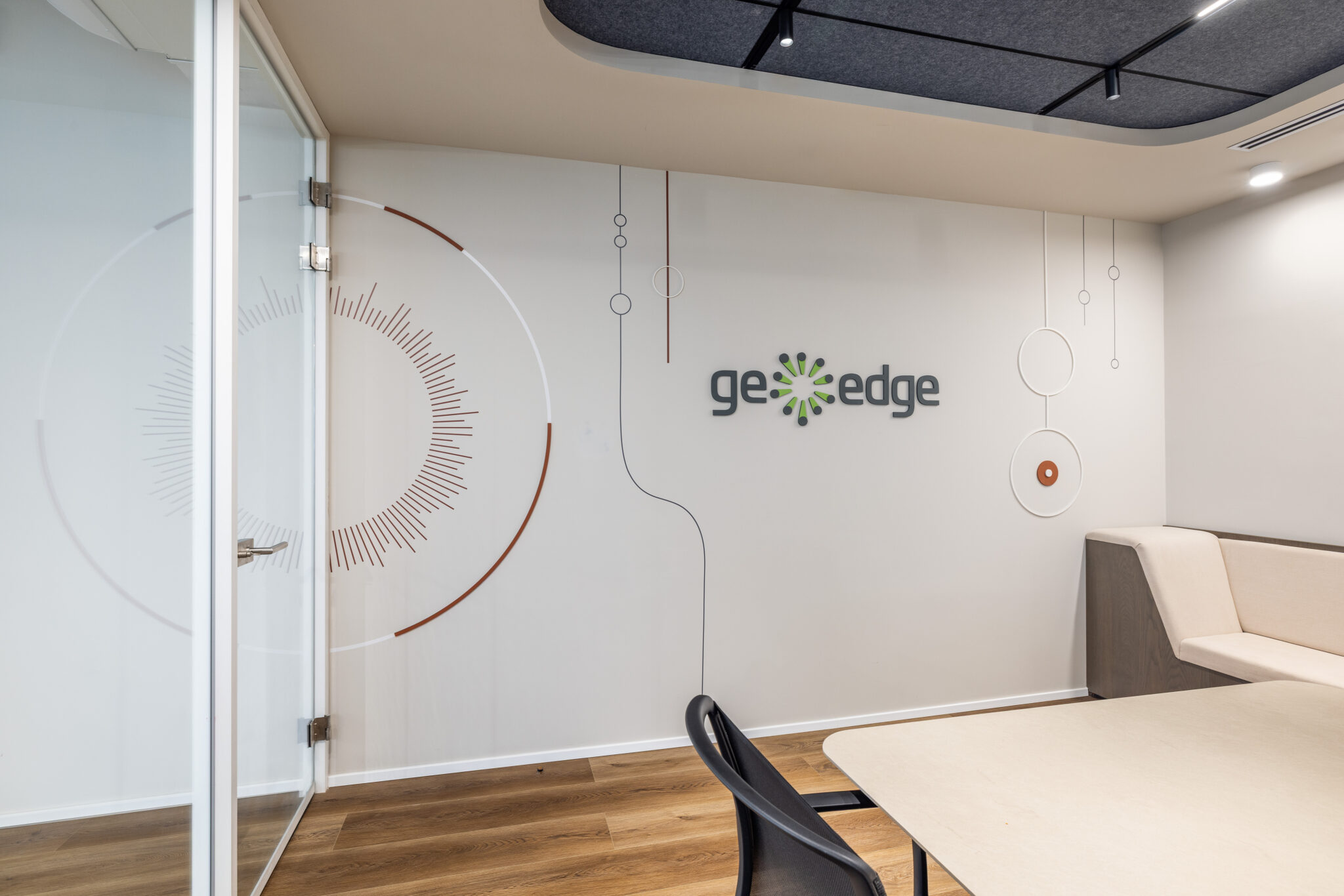 Meeting room with geoedge logo and line art wall graphic