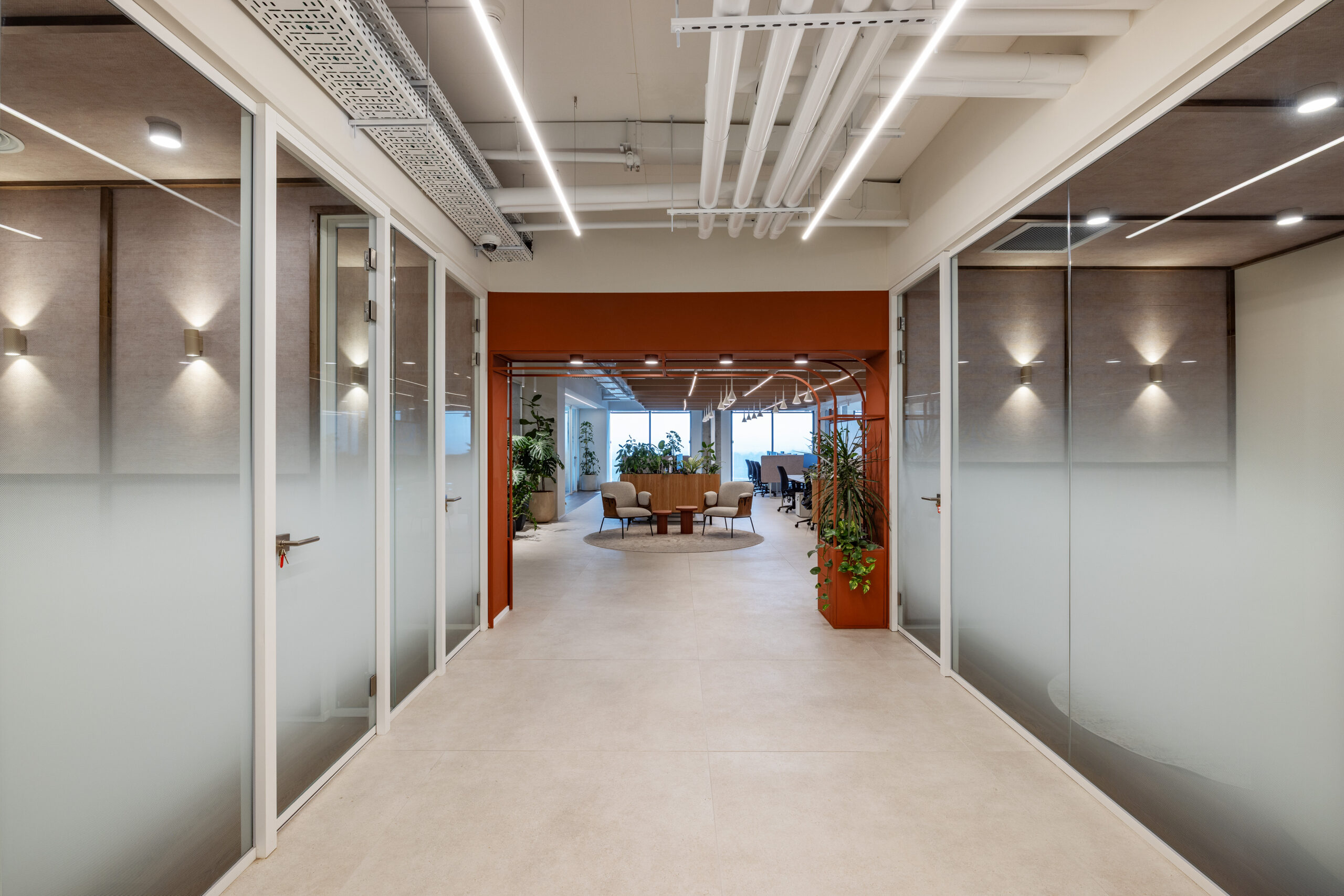 Corridor of frosted glass meeting rooms