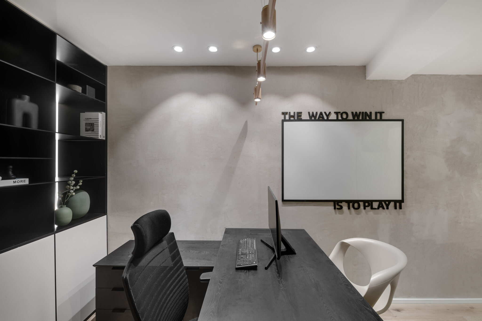 THE WAY TO WIN IT IS TO PLAY IT lettering above a whiteboard
