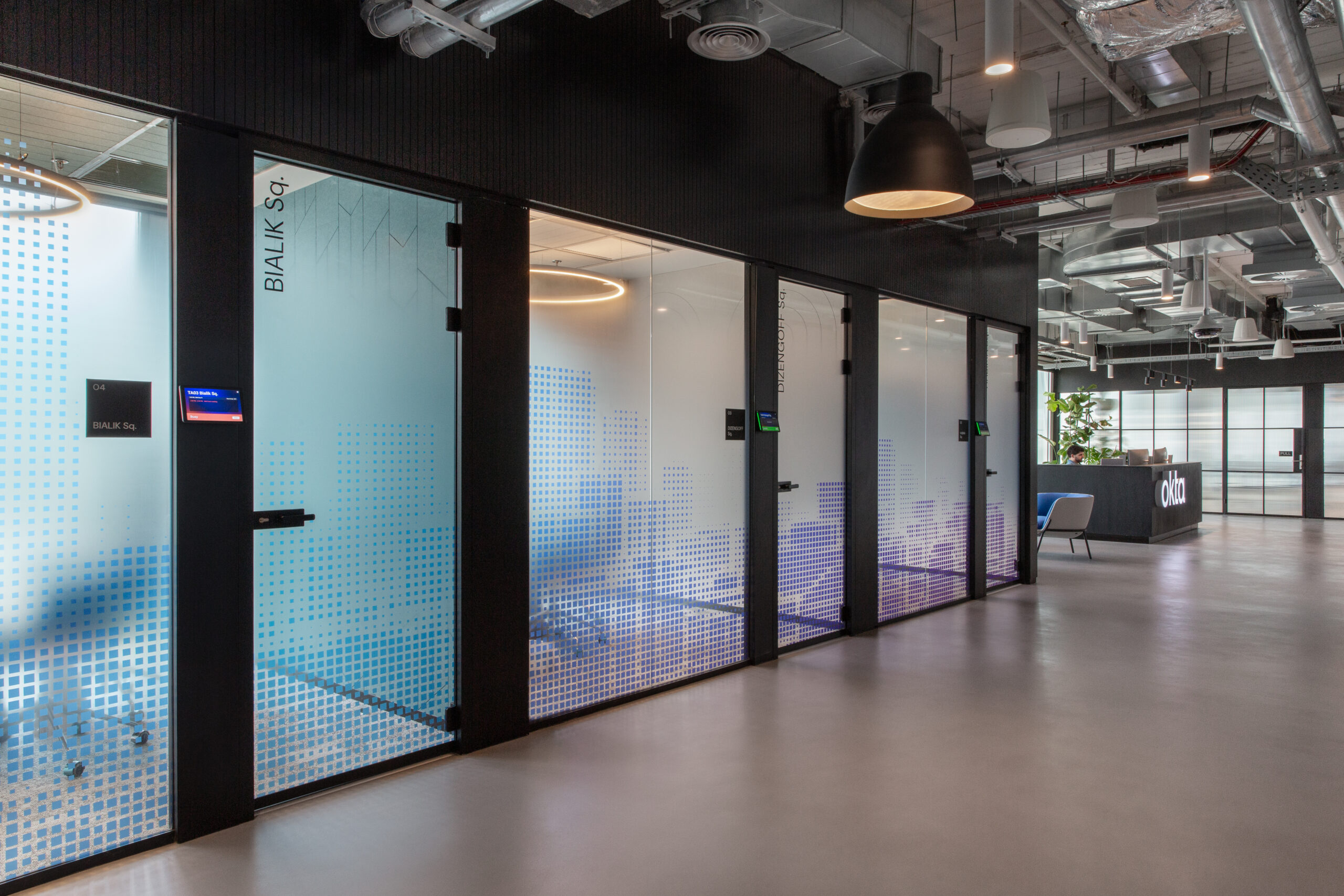 Glass meeting rooms with blue gradient pixel film