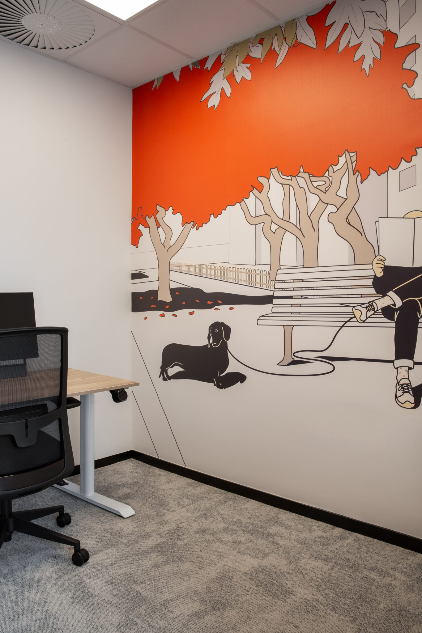 Small office with an orange park and dog illustration wall mural