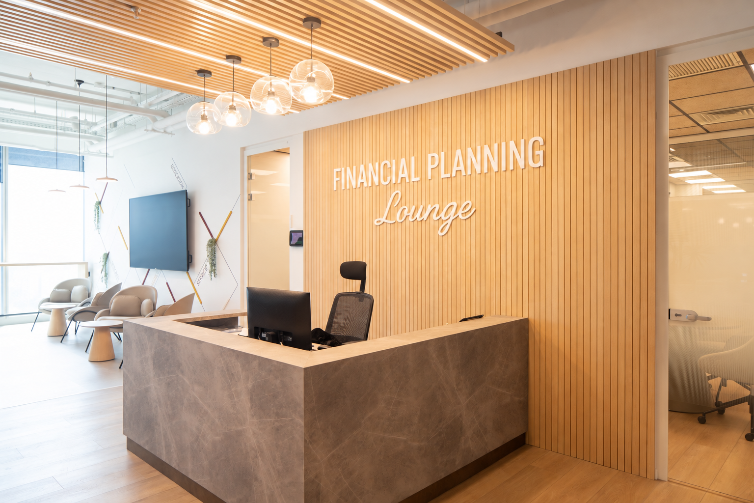 FINANCIAL PLANNING Lounge lettering behind a reception desk