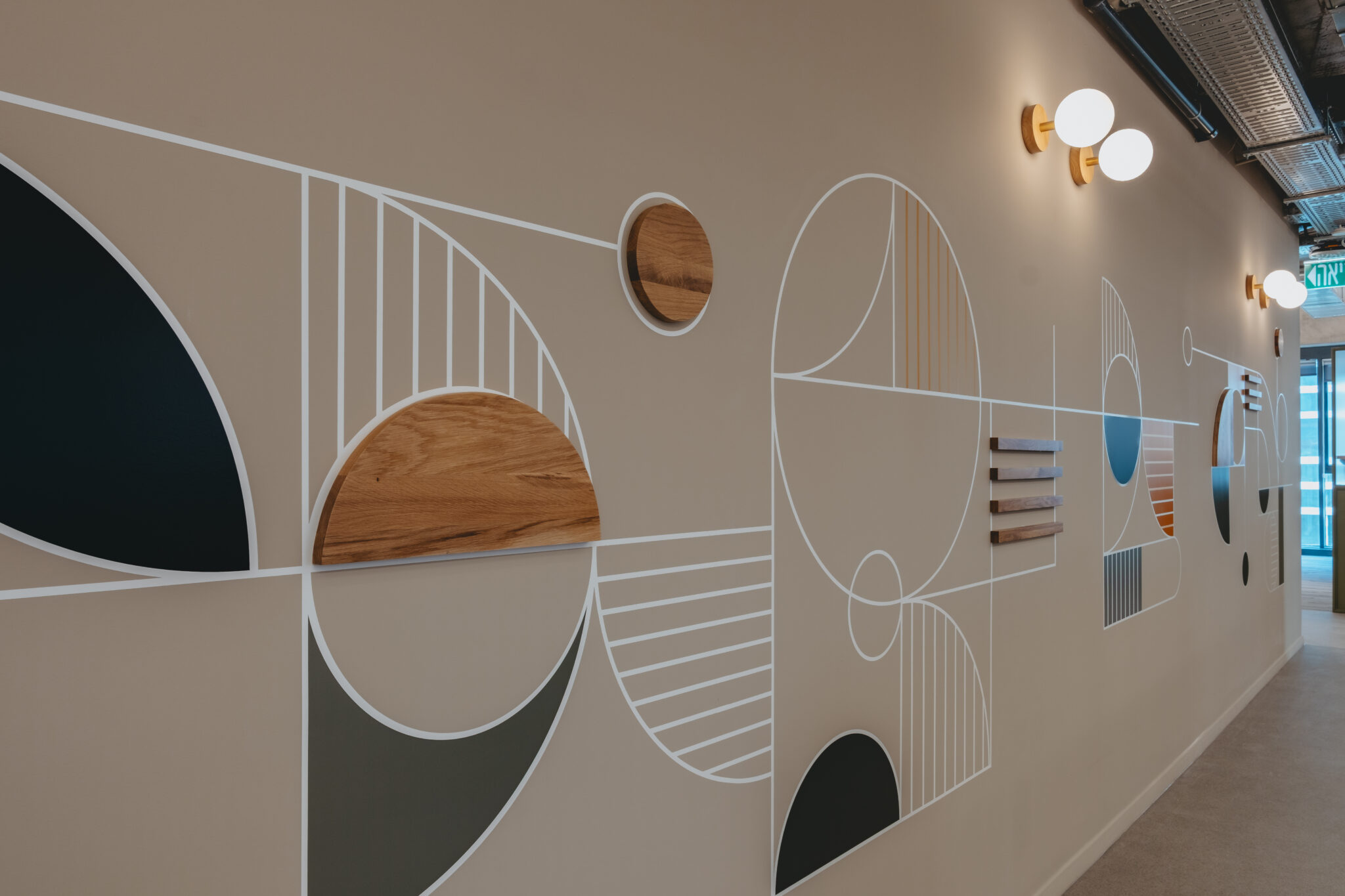 Geometric line wall graphic with wood half-circles