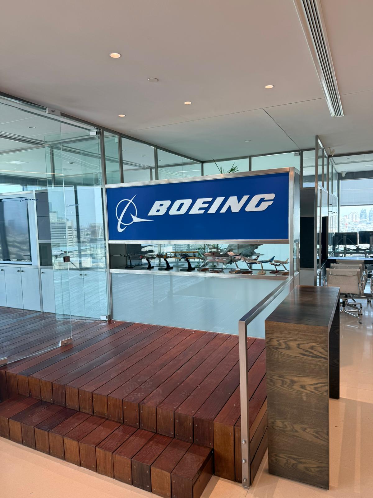 BOEING logo on a glass partition in an office