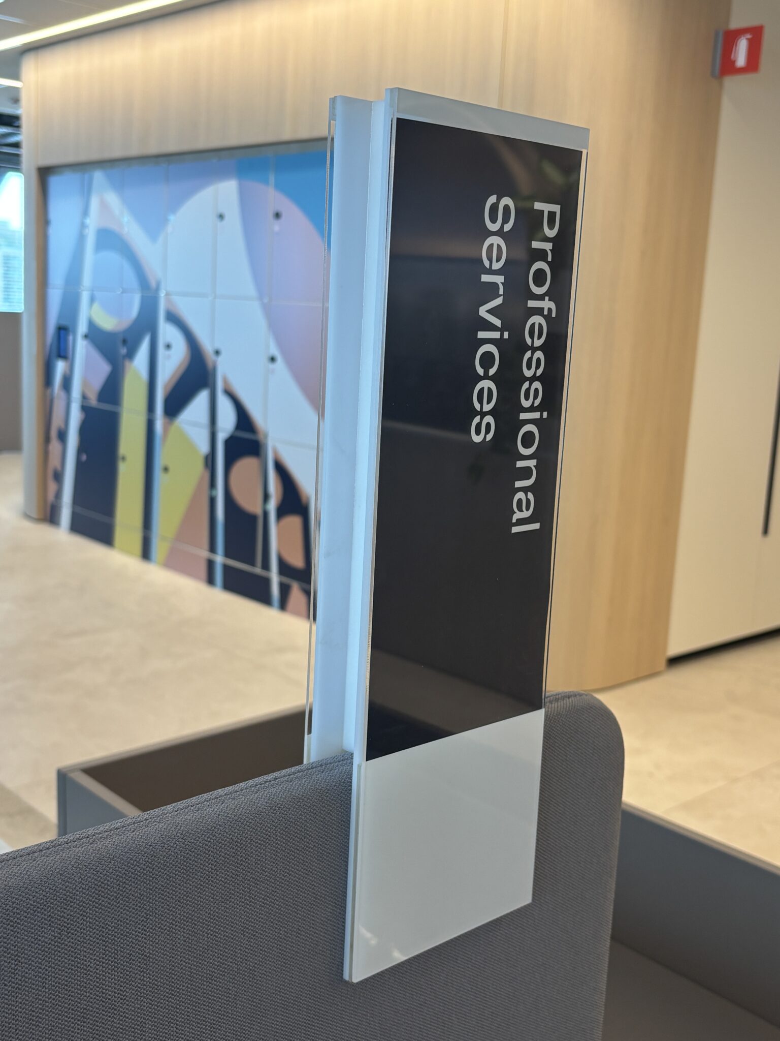 Professional Services hanging sign above workstations