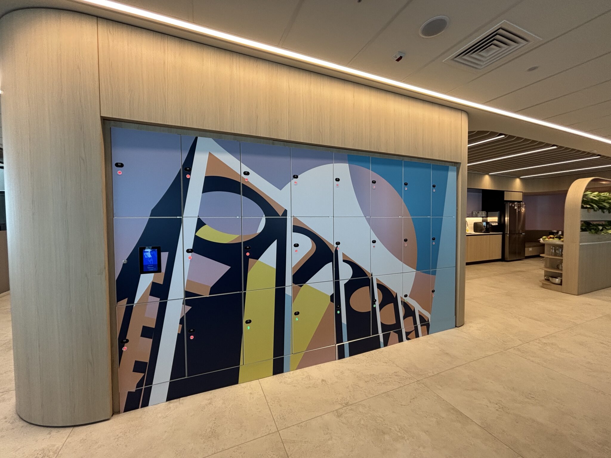 Colourful abstract graphic printed on a wall of lockers