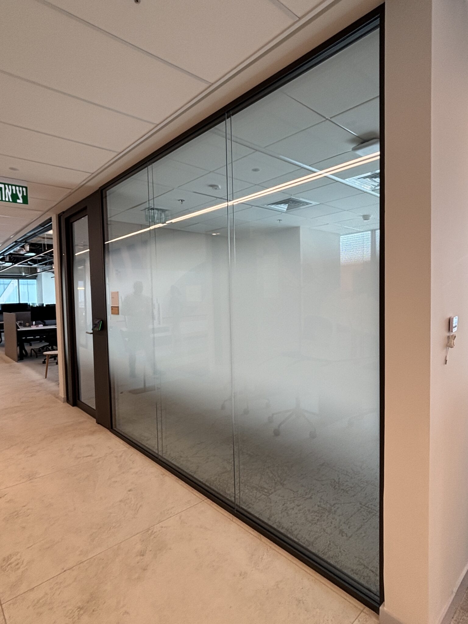 Glass office wall with frosted gradient film