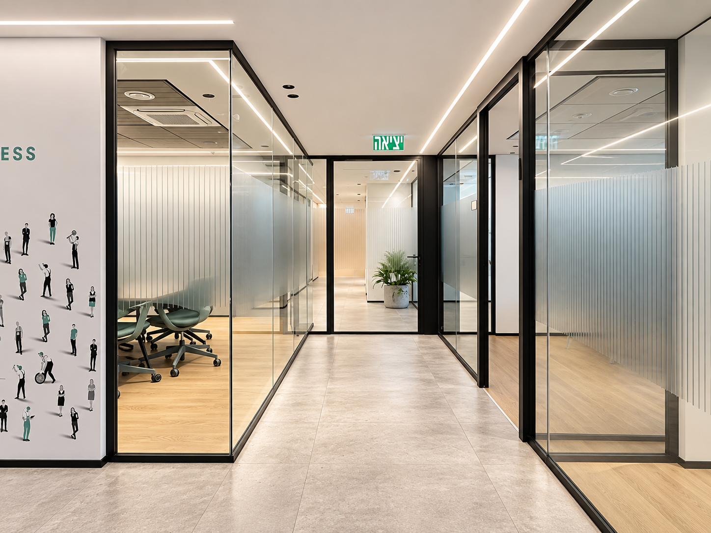 Glass meeting rooms with vertical stripe film along a corridor