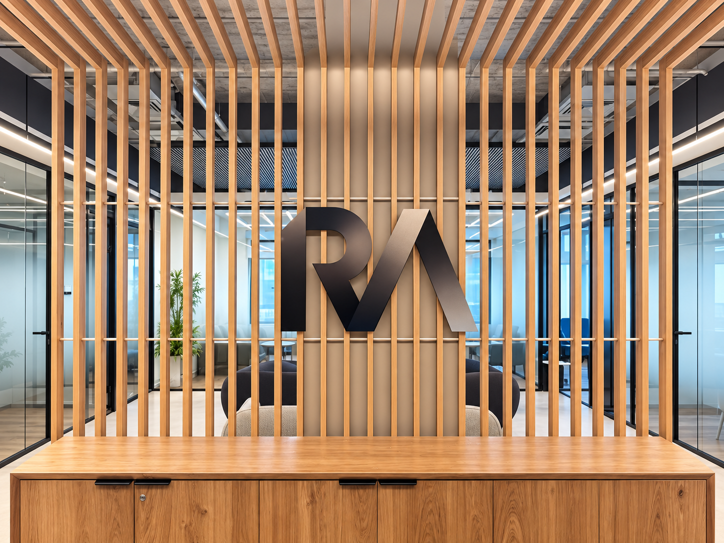 Black RA logo on a wood slat partition
