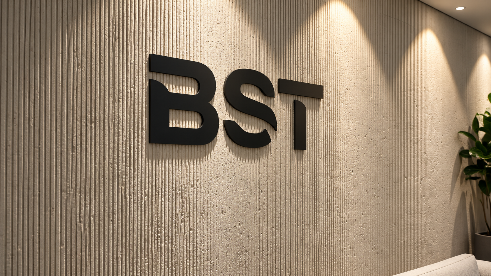 BST black 3D letters on a textured wall