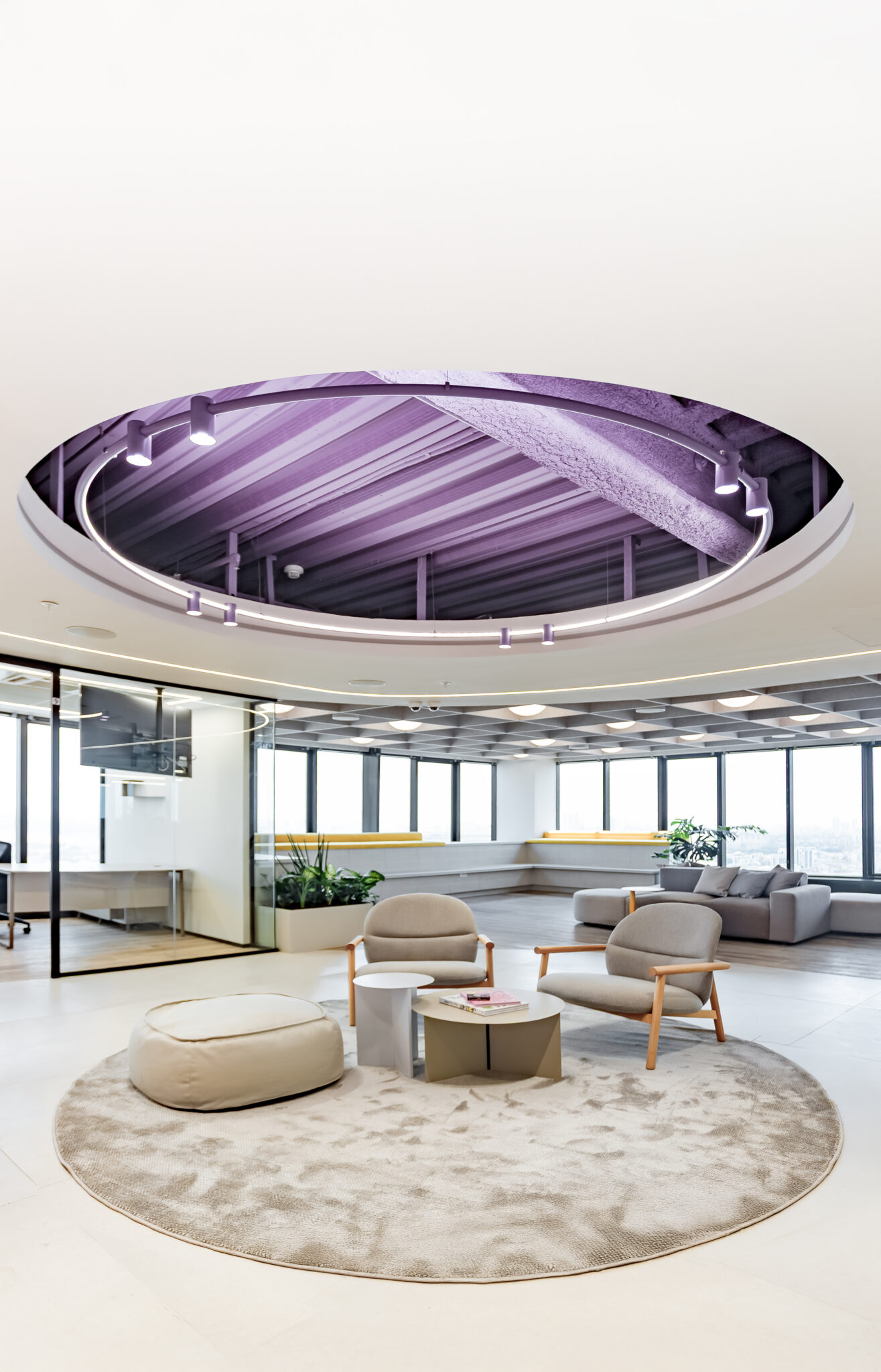 Round ceiling feature above a lounge with a circular rug